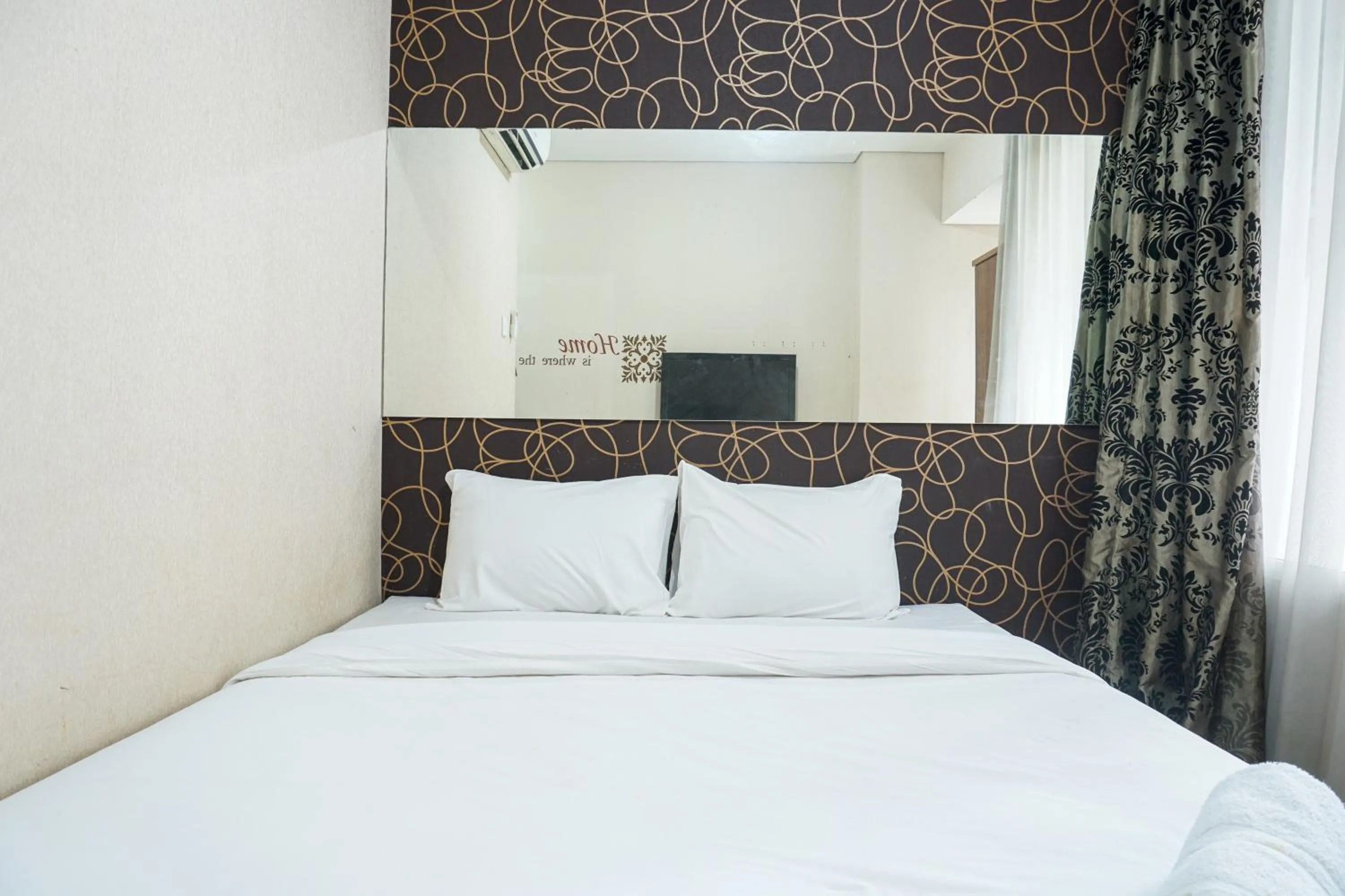 Bed in Elegant Studio Apartment at Nifarro Park By Travelio