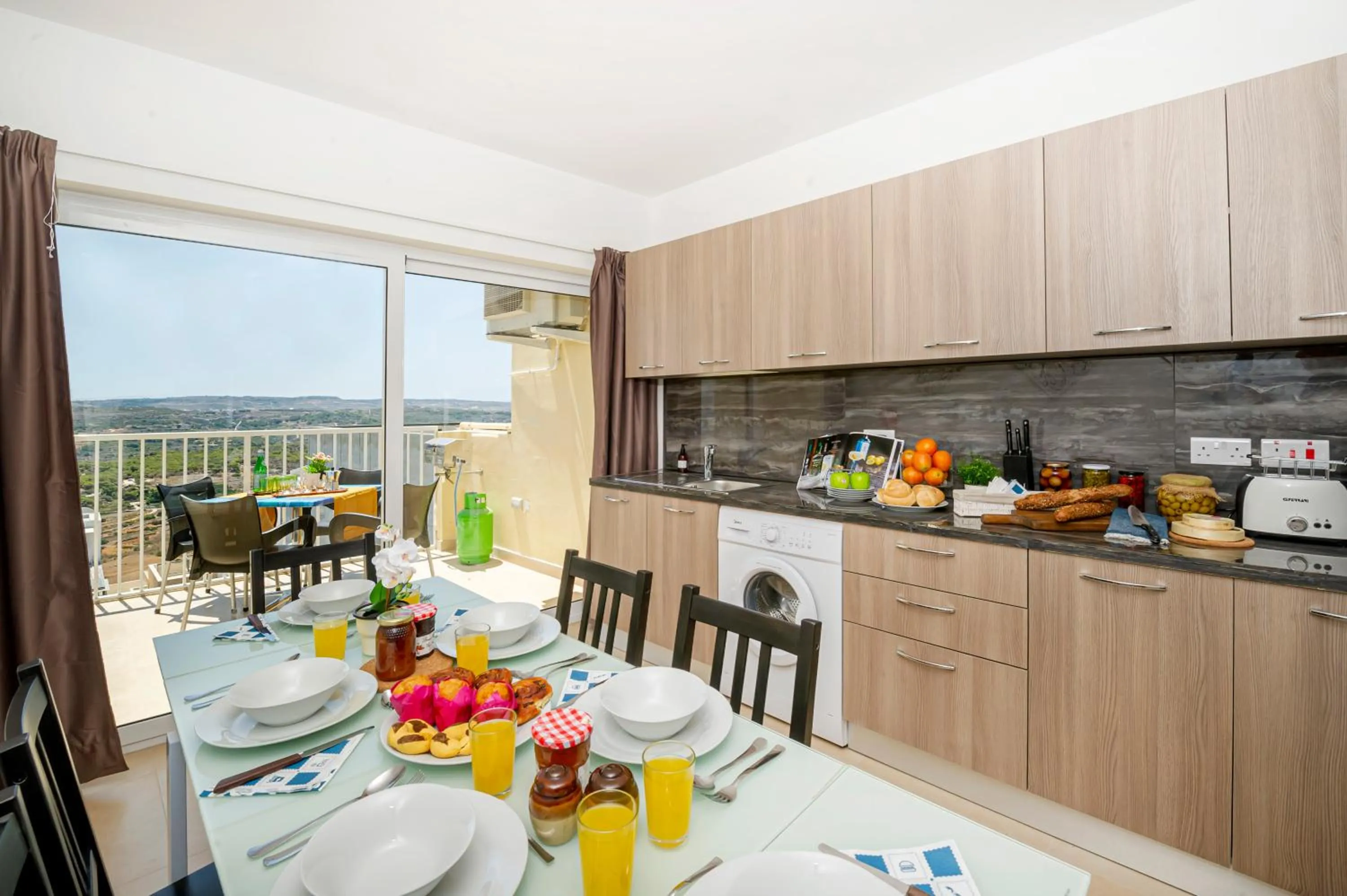Property building in Summer Breeze Apartment with panoramic terrace - by Getawaysmalta