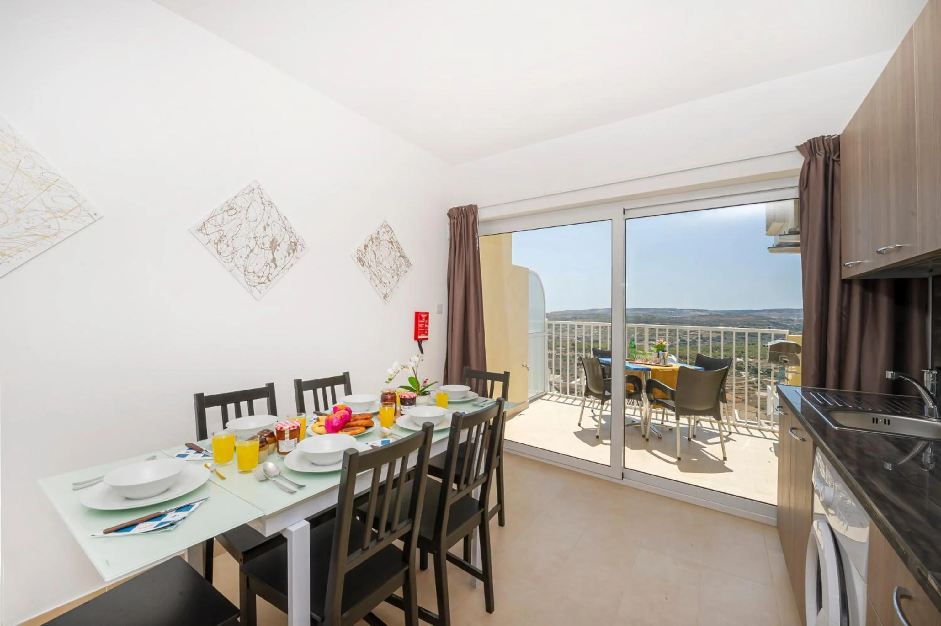 Property building in Summer Breeze Apartment with panoramic terrace - by Getawaysmalta