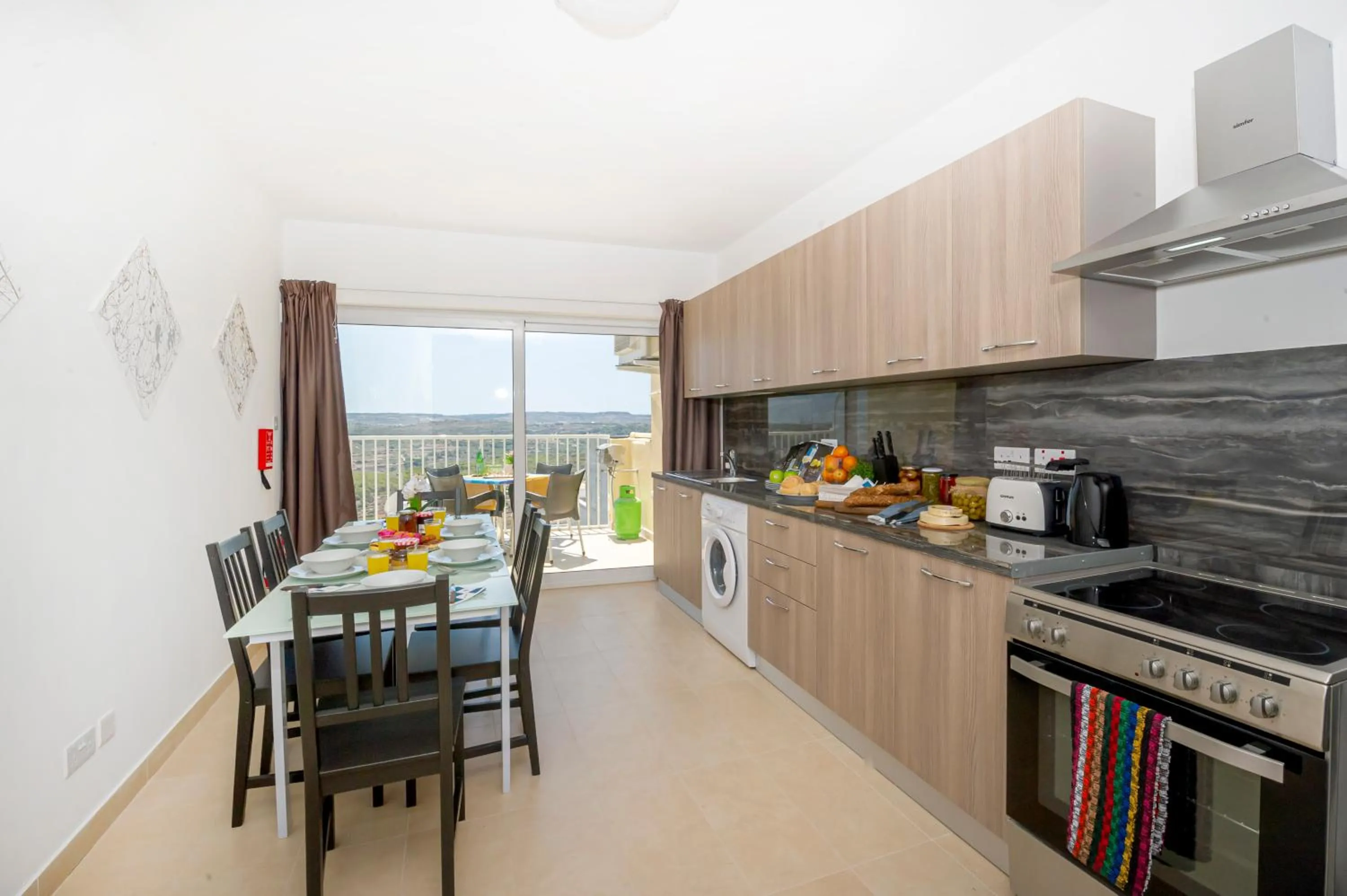 Property building in Summer Breeze Apartment with panoramic terrace - by Getawaysmalta