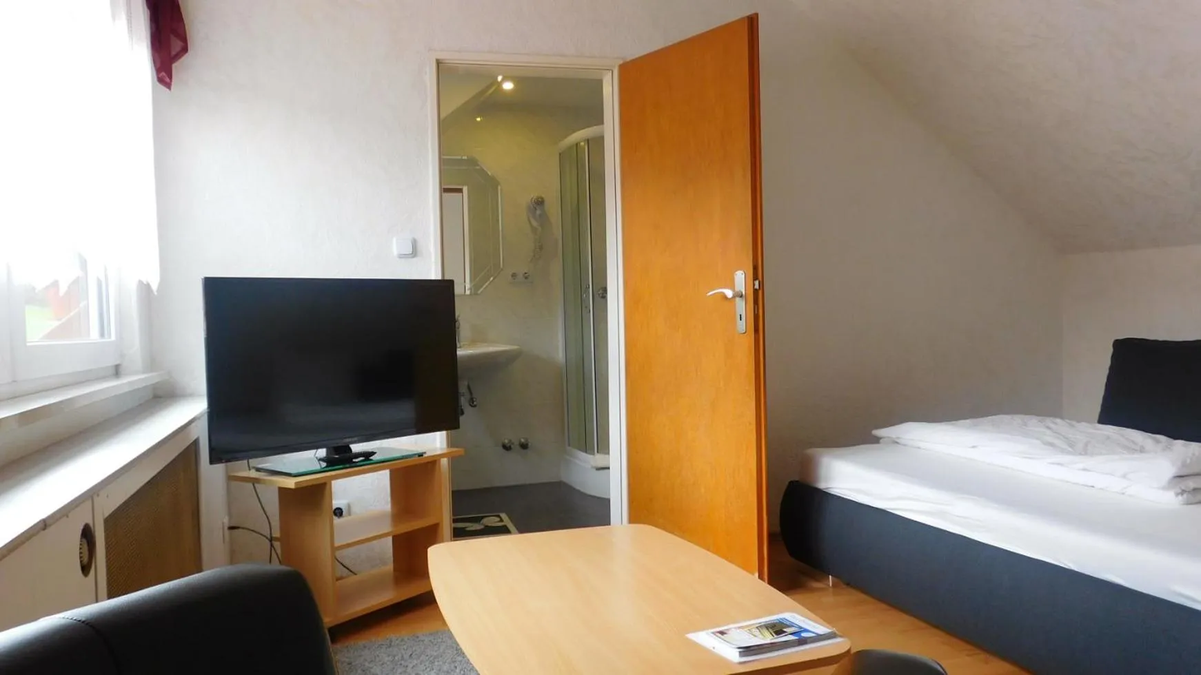 Photo of the whole room, Bed in Hotel Pension am Kurmittelhaus