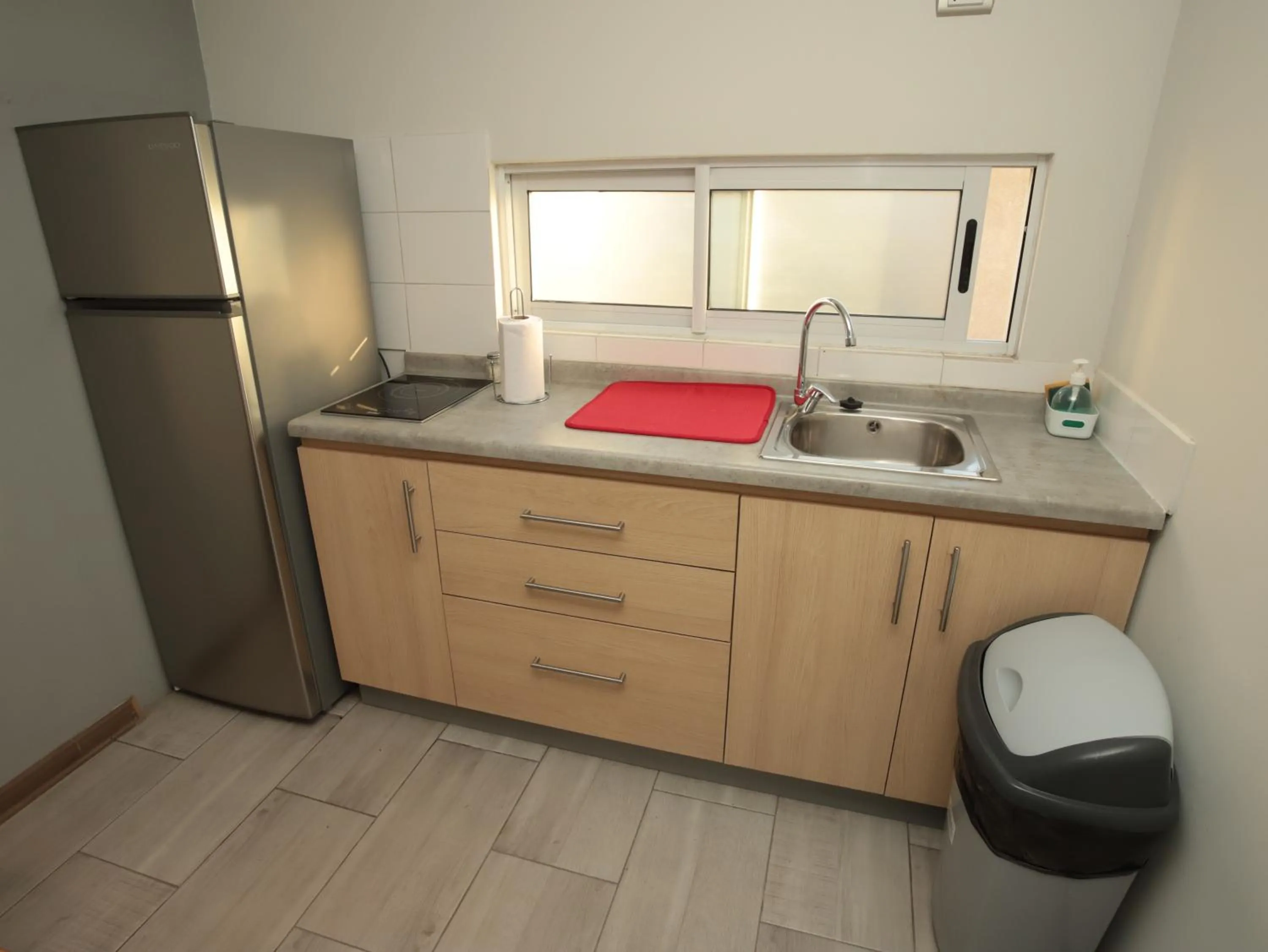 Kitchen or kitchenette in De Triana Hotel