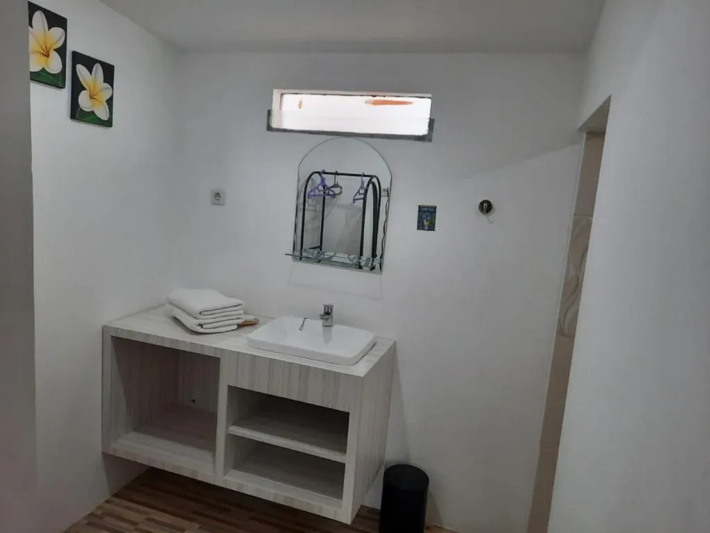 Bathroom in GRANADA INN PALU