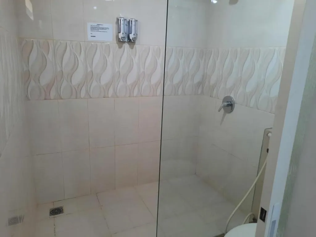 Bathroom in GRANADA INN PALU