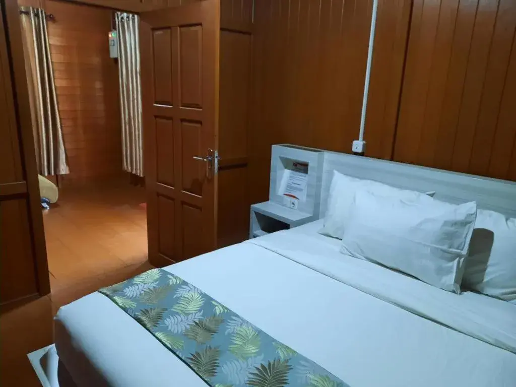 Bed in GRANADA INN PALU Bed in GRANADA INN PALU