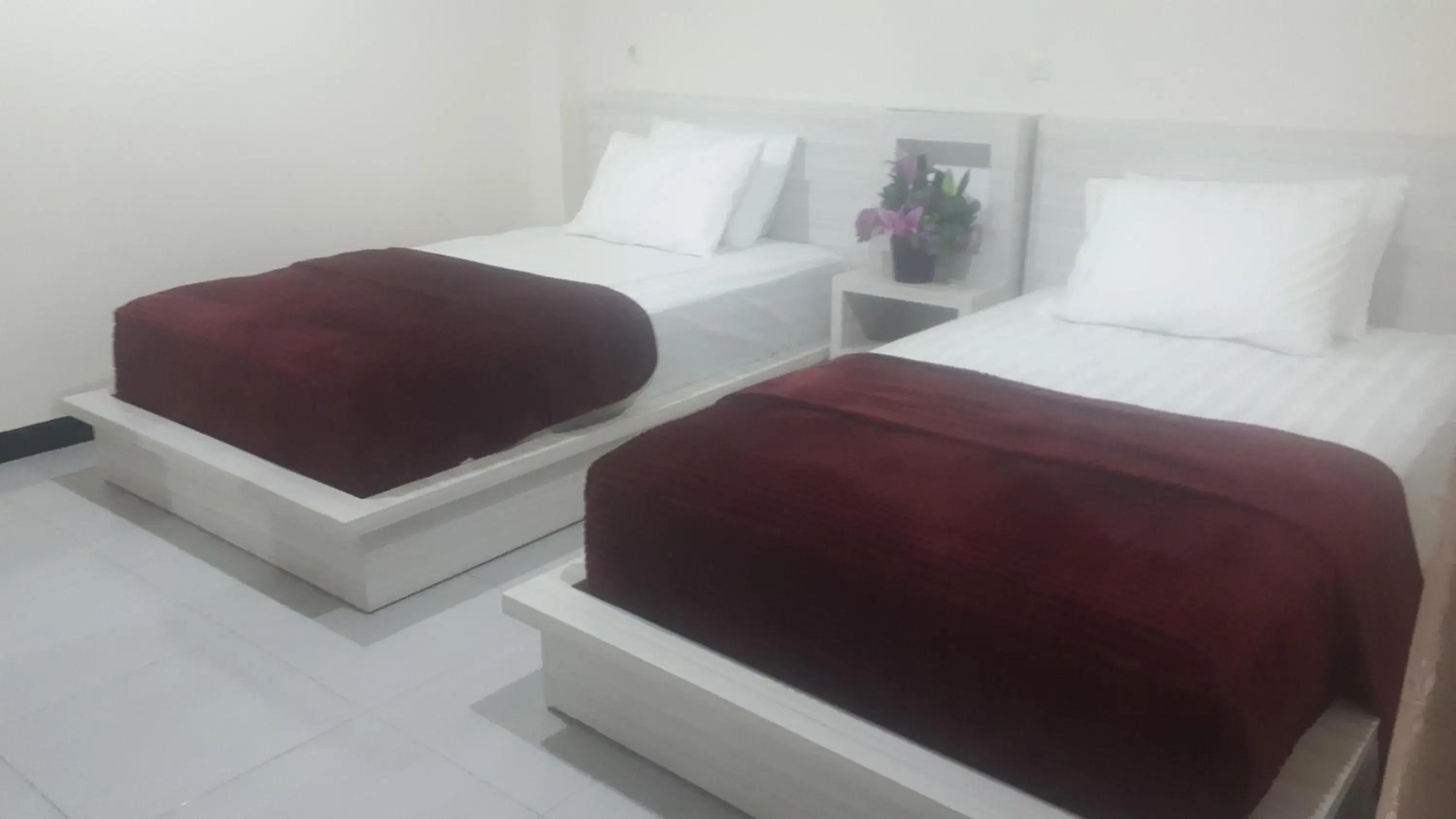 Bed in GRANADA INN PALU Bed in GRANADA INN PALU