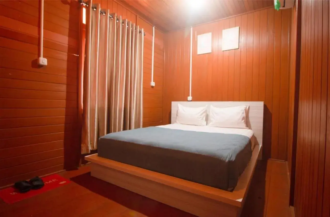 Bed in GRANADA INN PALU Bed in GRANADA INN PALU
