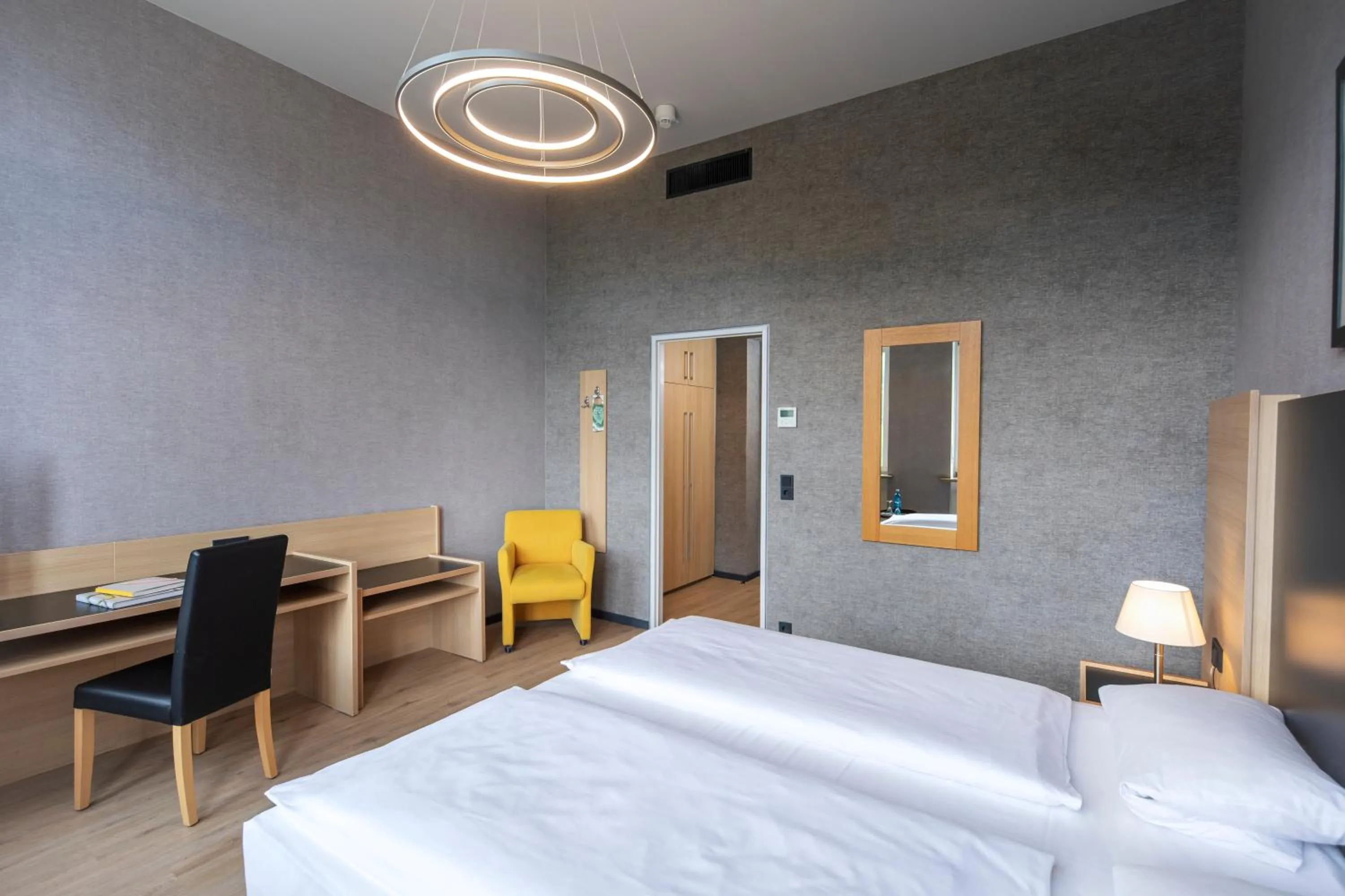 Photo of the whole room, Bed in Michel Hotel Franziskushöhe Lohr am Main