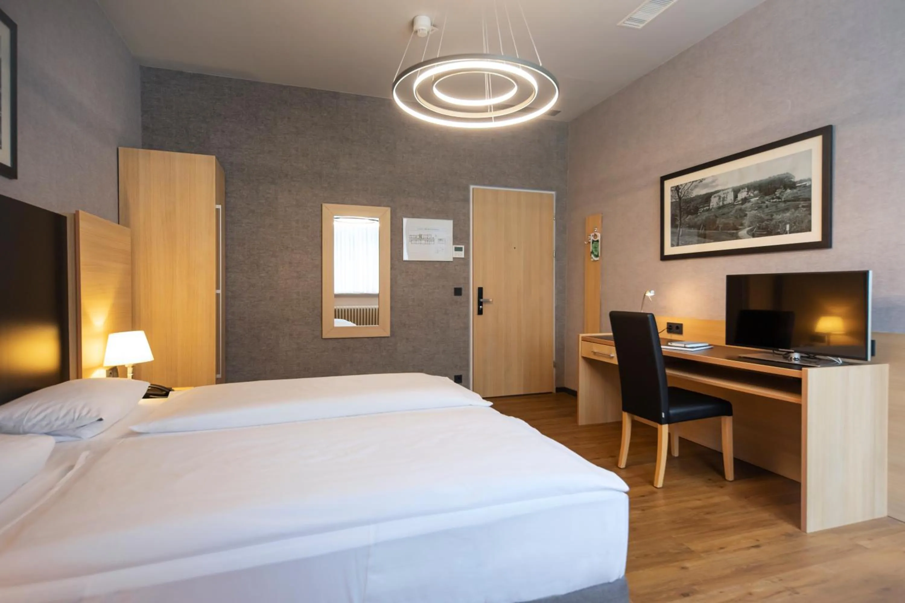 Photo of the whole room, Bed in Michel Hotel Franziskushöhe Lohr am Main