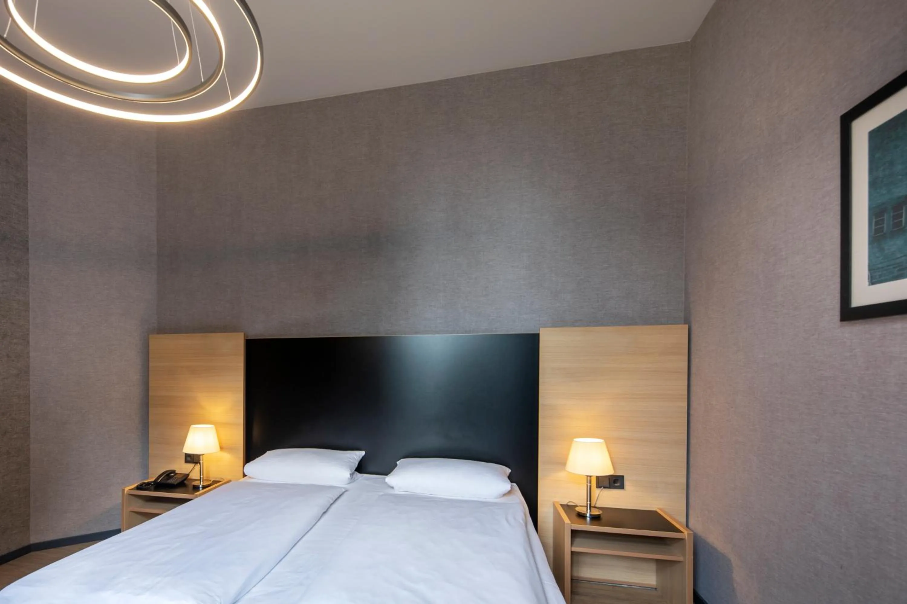 Photo of the whole room, Bed in Michel Hotel Franziskushöhe Lohr am Main