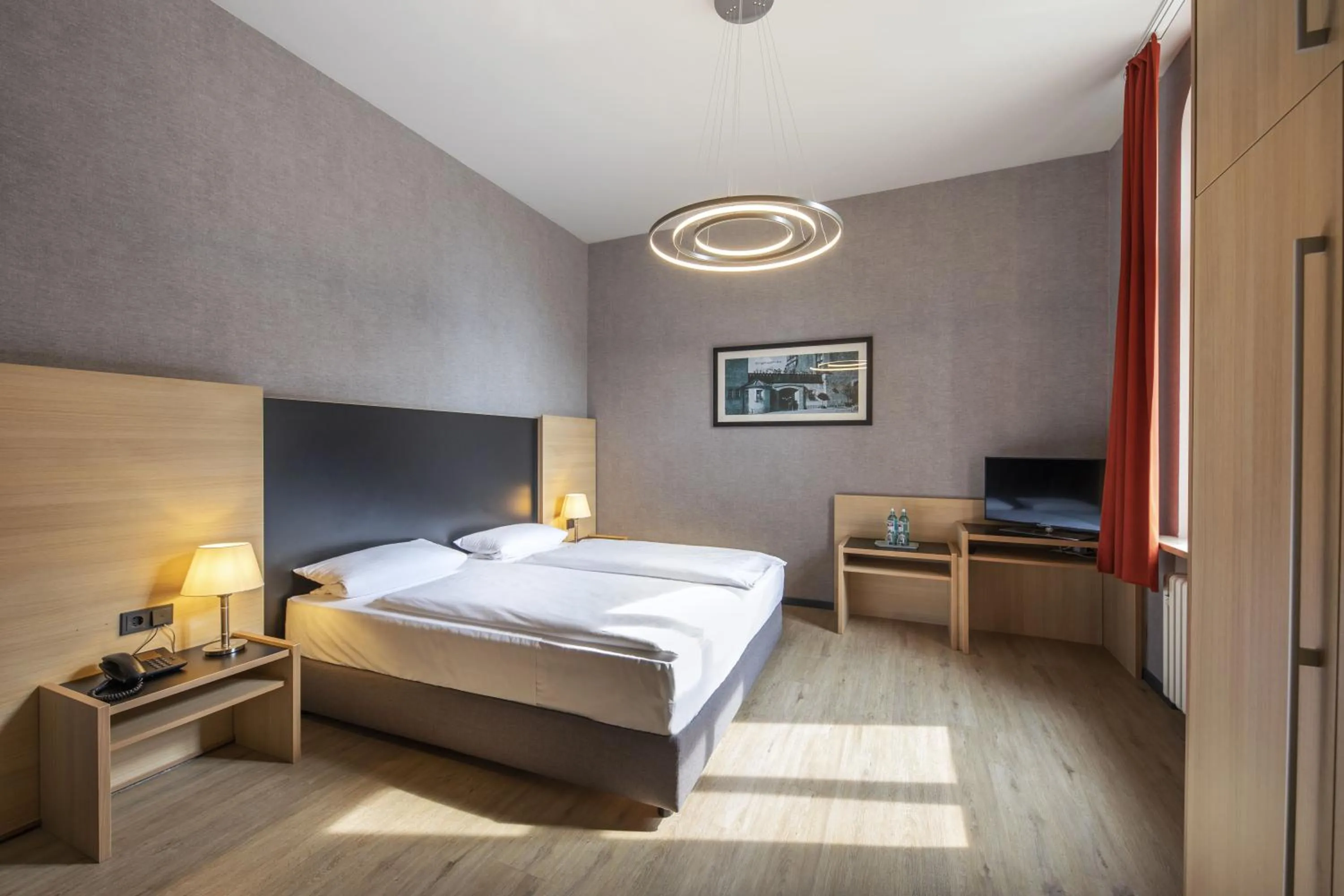 Photo of the whole room, Bed in Michel Hotel Franziskushöhe Lohr am Main