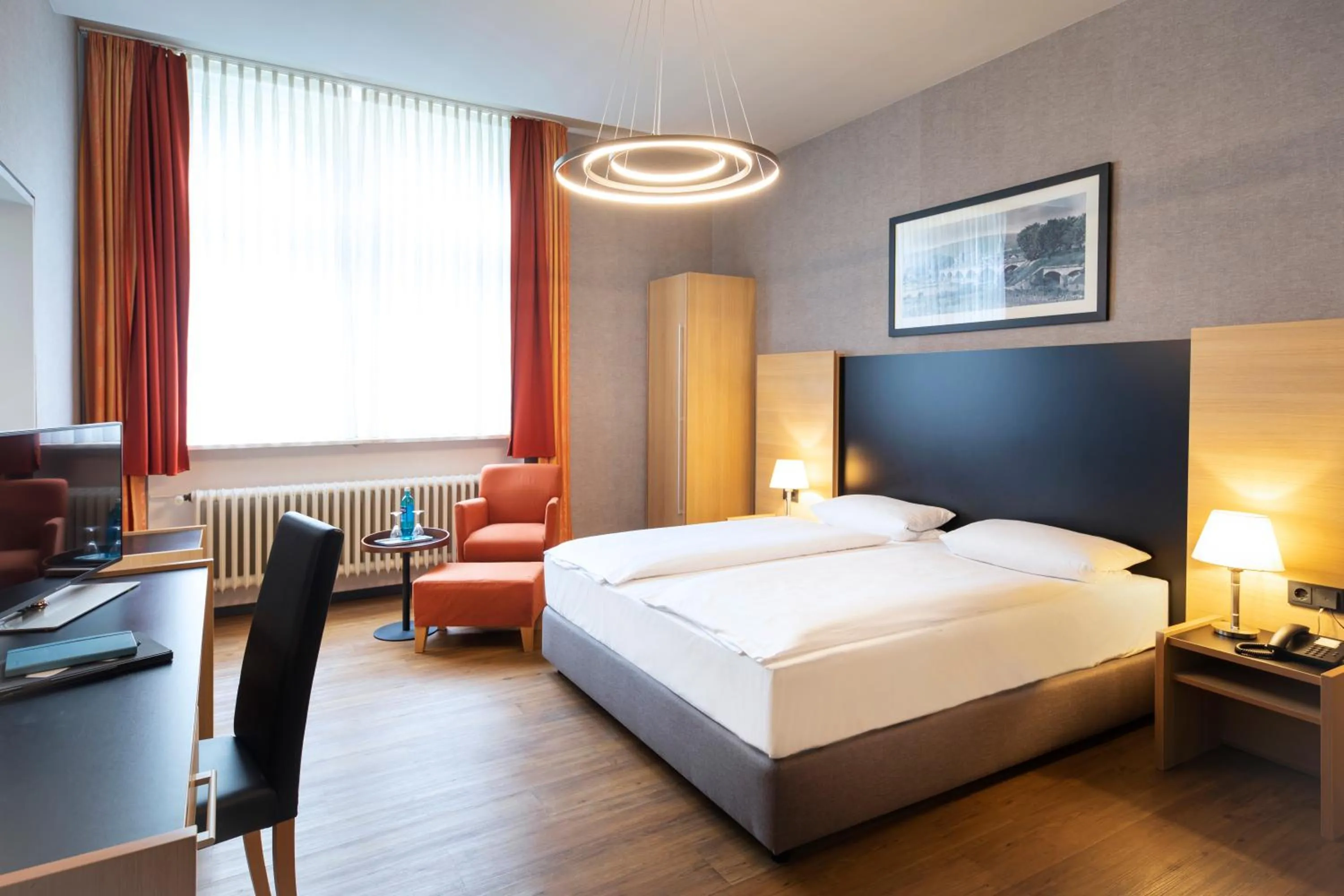 Photo of the whole room, Bed in Michel Hotel Franziskushöhe Lohr am Main