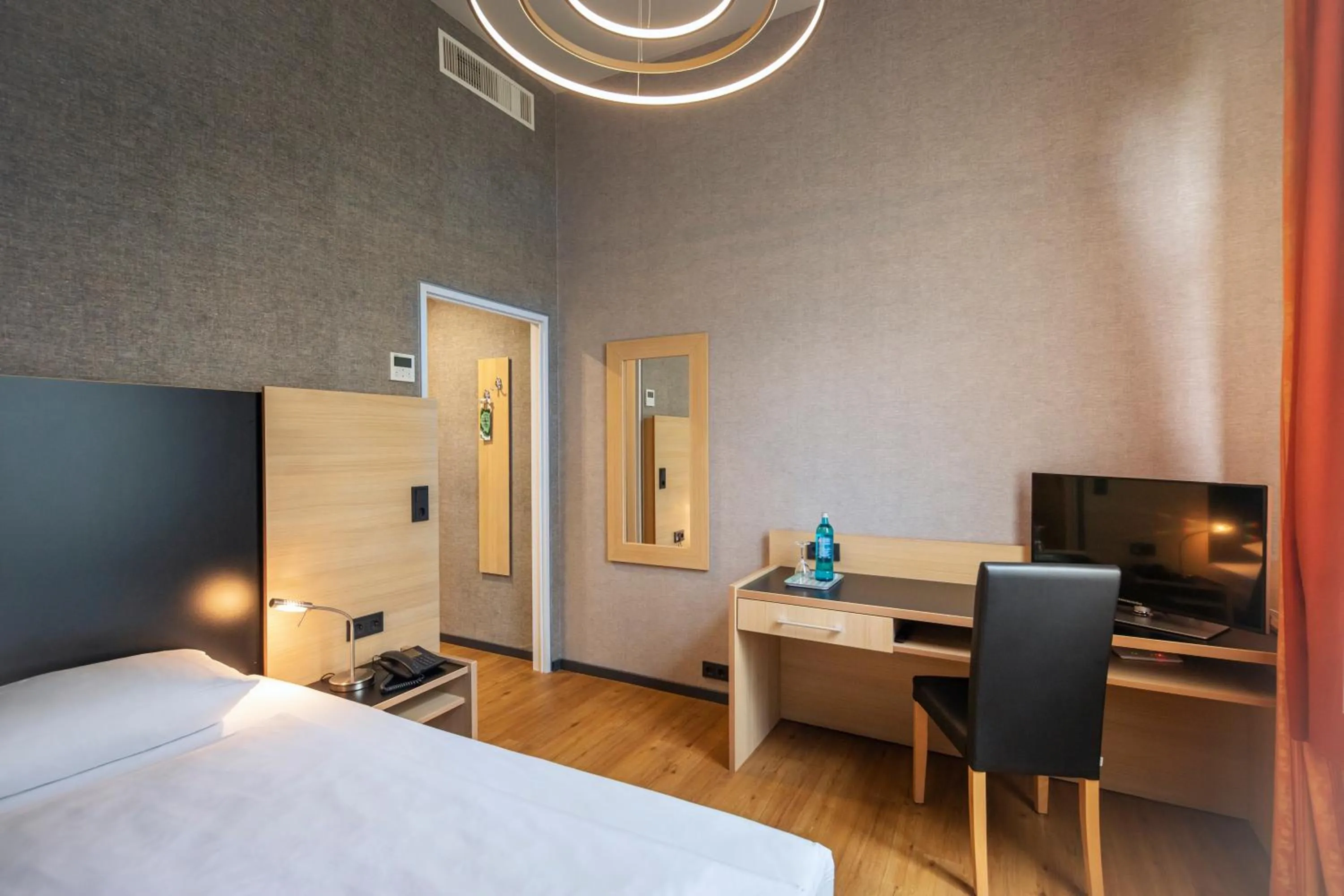 Photo of the whole room, Bed in Michel Hotel Franziskushöhe Lohr am Main