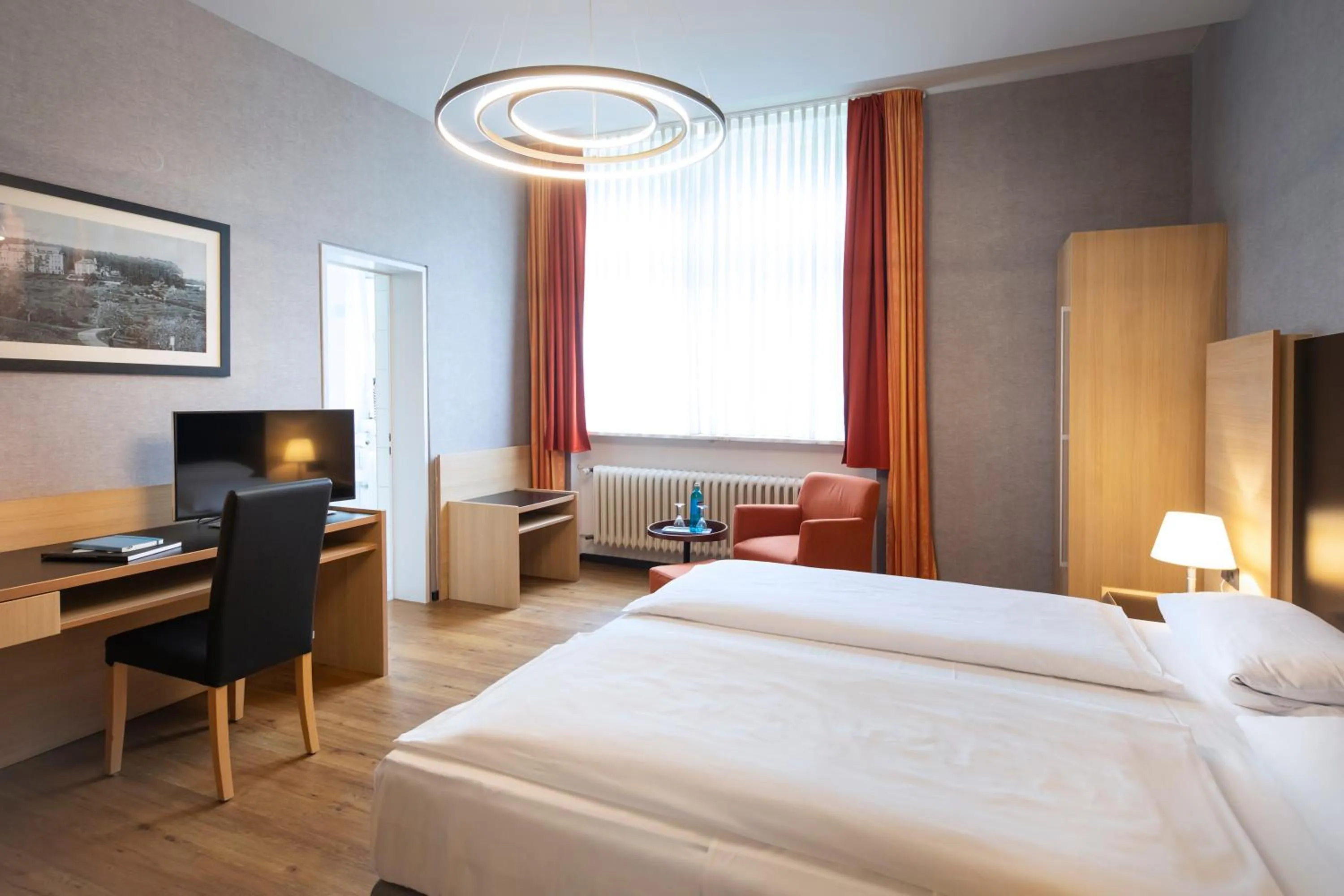 Photo of the whole room, Bed in Michel Hotel Franziskushöhe Lohr am Main