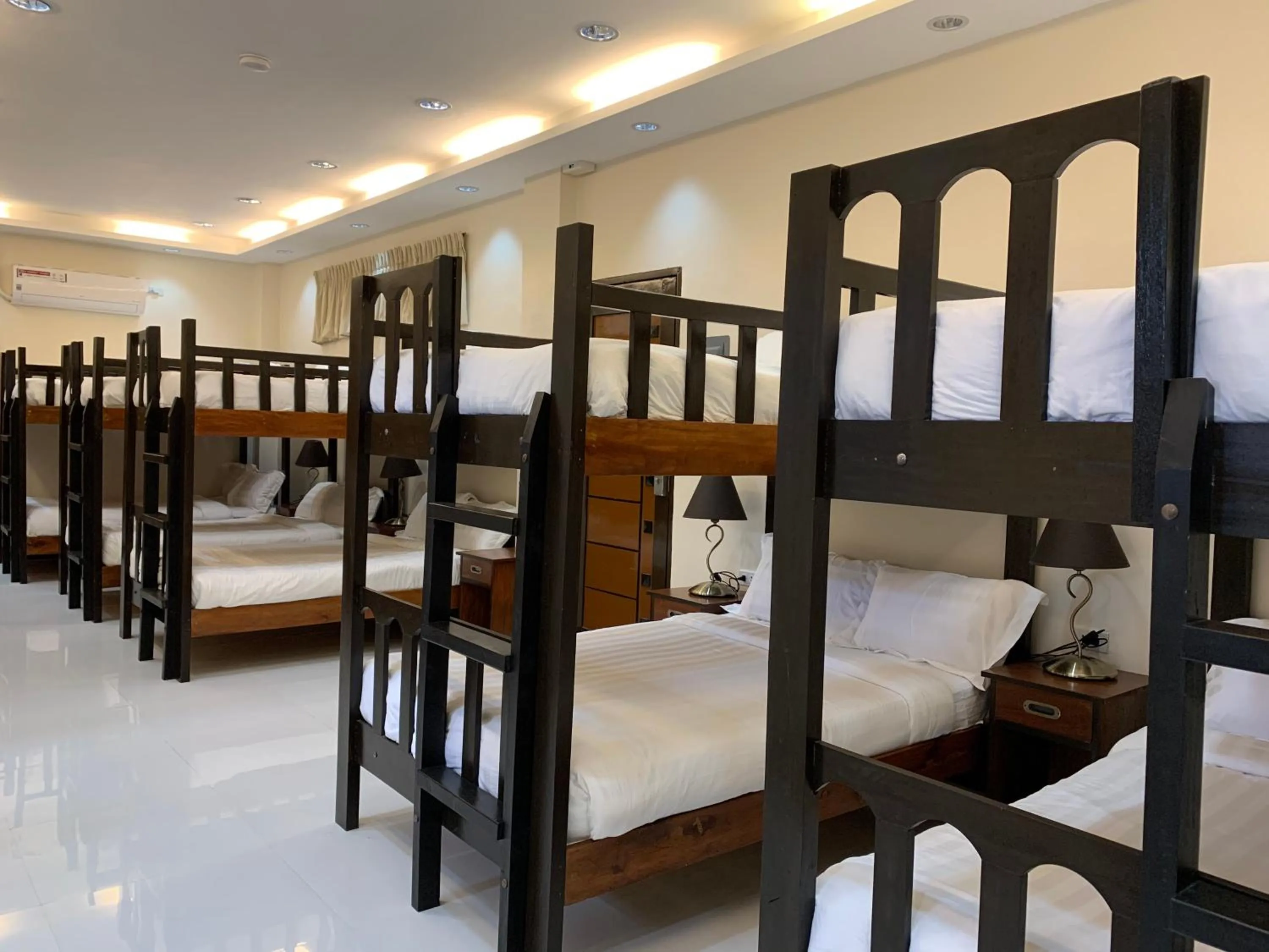 Bed in Villa MJ Maristela Beach Resort