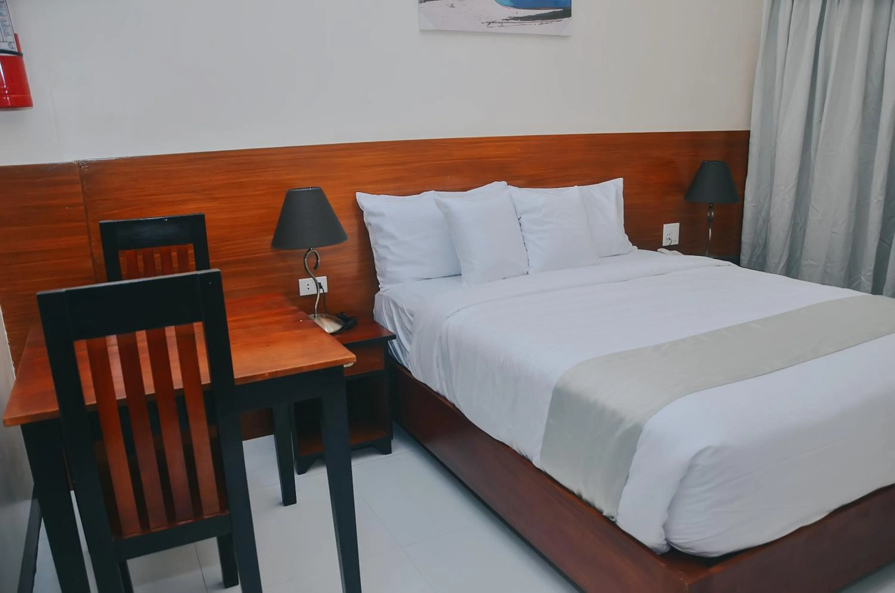 Bed in Villa MJ Maristela Beach Resort
