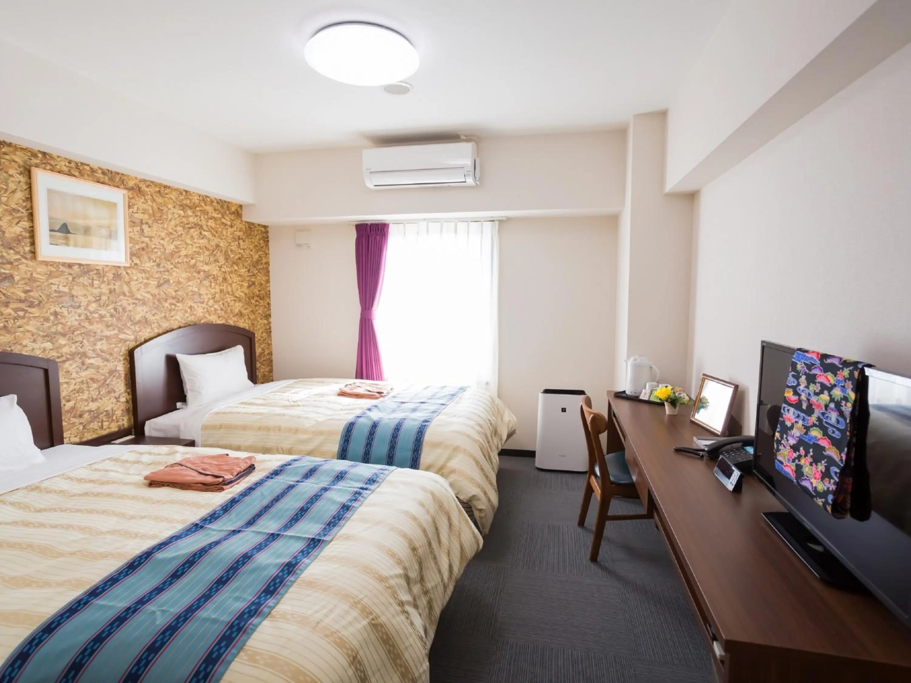 Bed in Hotel Peace Island Nago