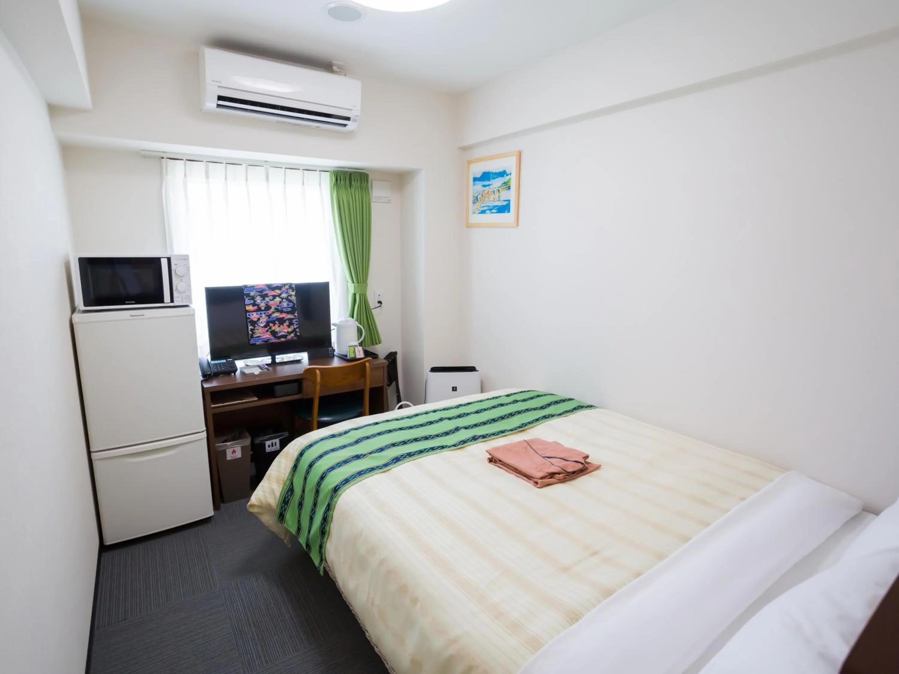 Bed in Hotel Peace Island Nago