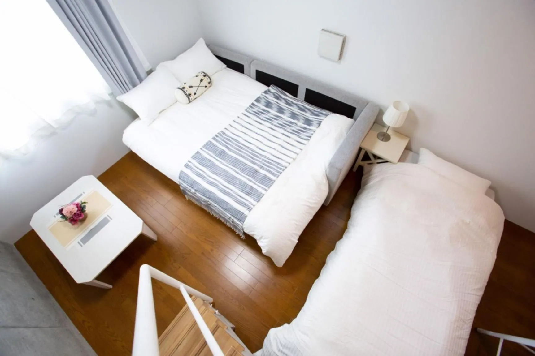 Bed in Laffitte Hirai Condominium Hotel