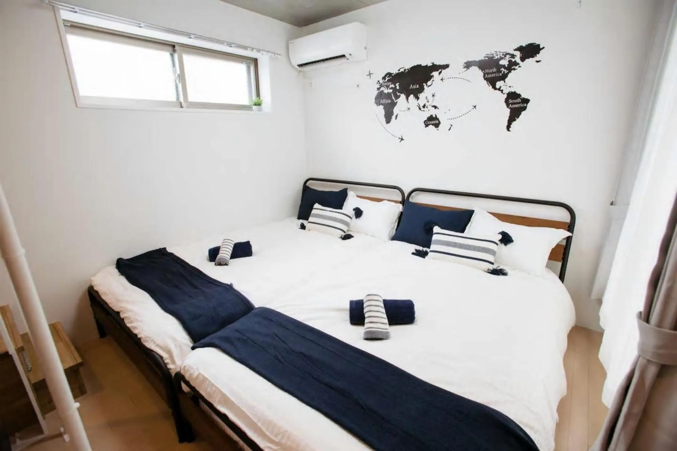 Bed in Laffitte Hirai Condominium Hotel