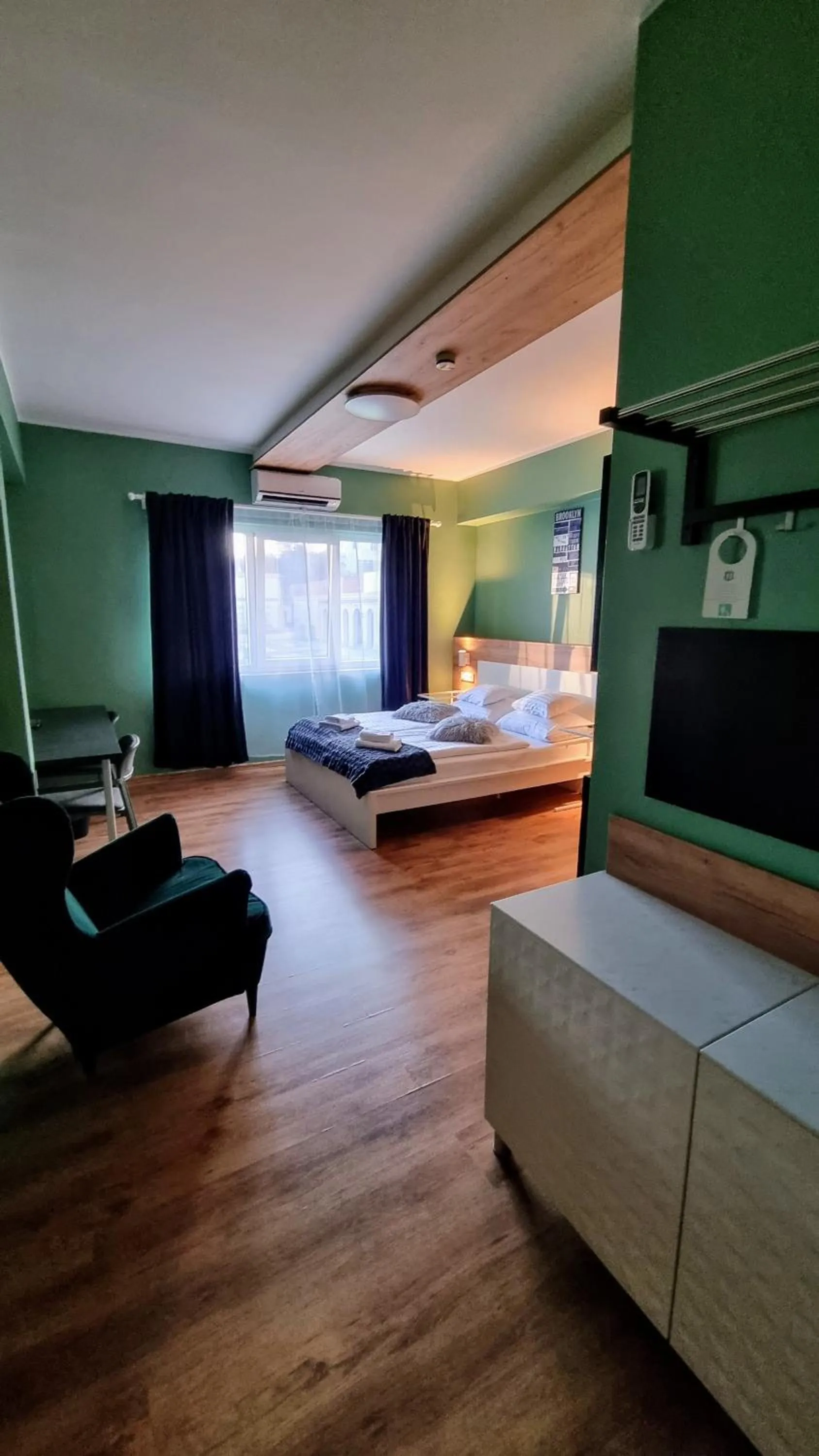 Communal lounge/ TV room, Bed in Boutique Hotel & Event Center