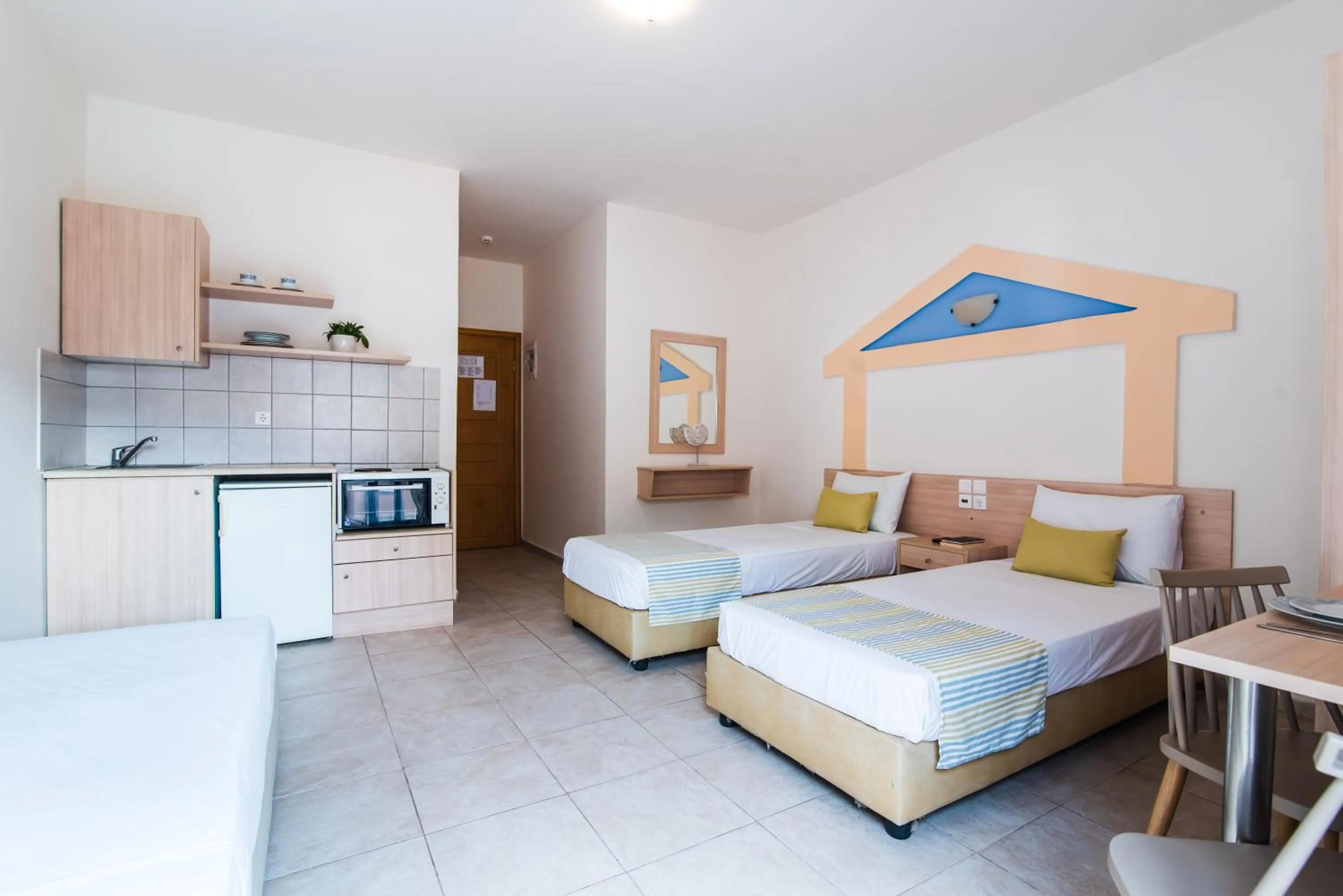 Kitchen or kitchenette, Bed in Ilios Malia Hotel Resort