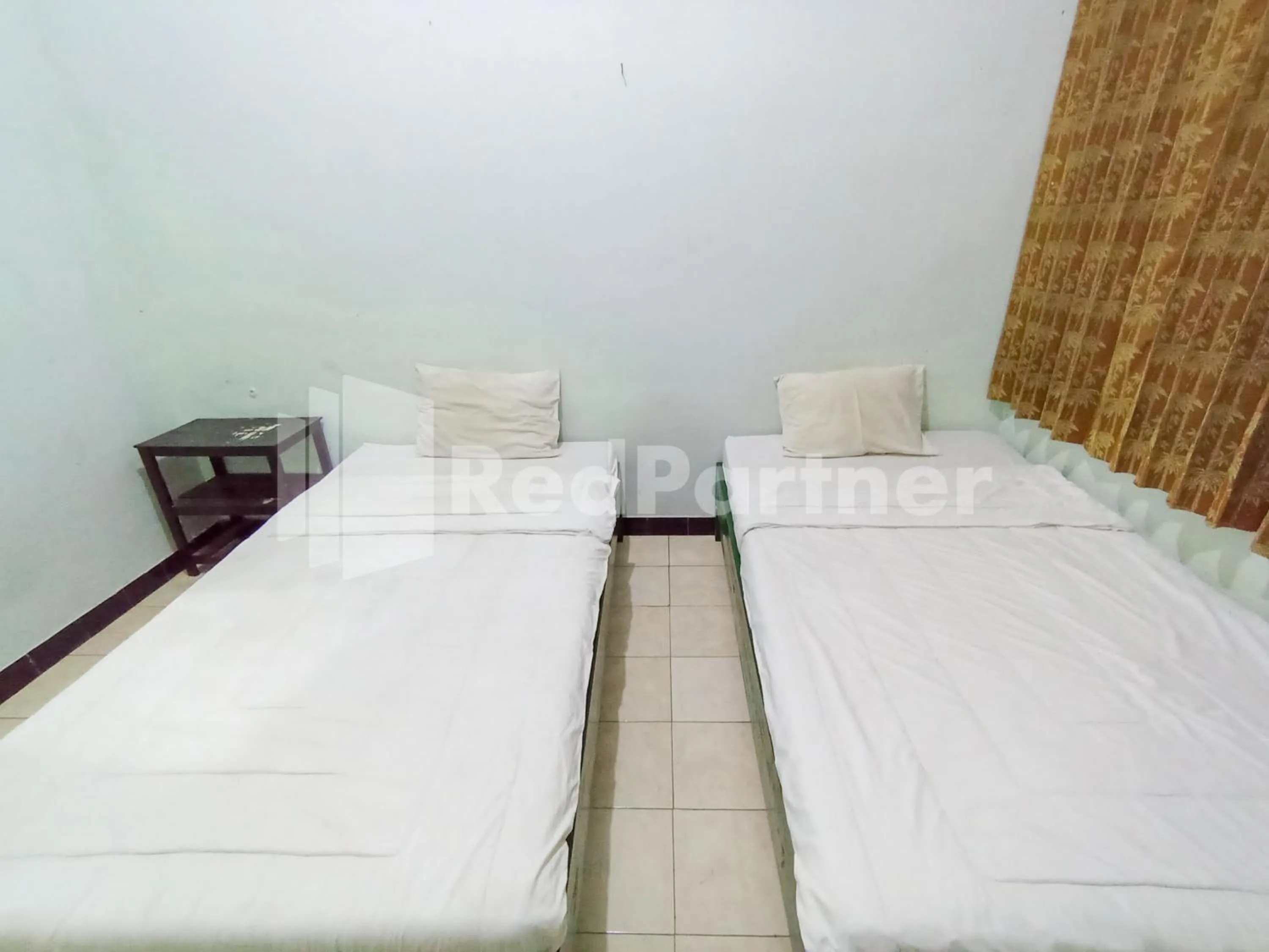 Bedroom, Bed in Orange inn RedPartner Madiun