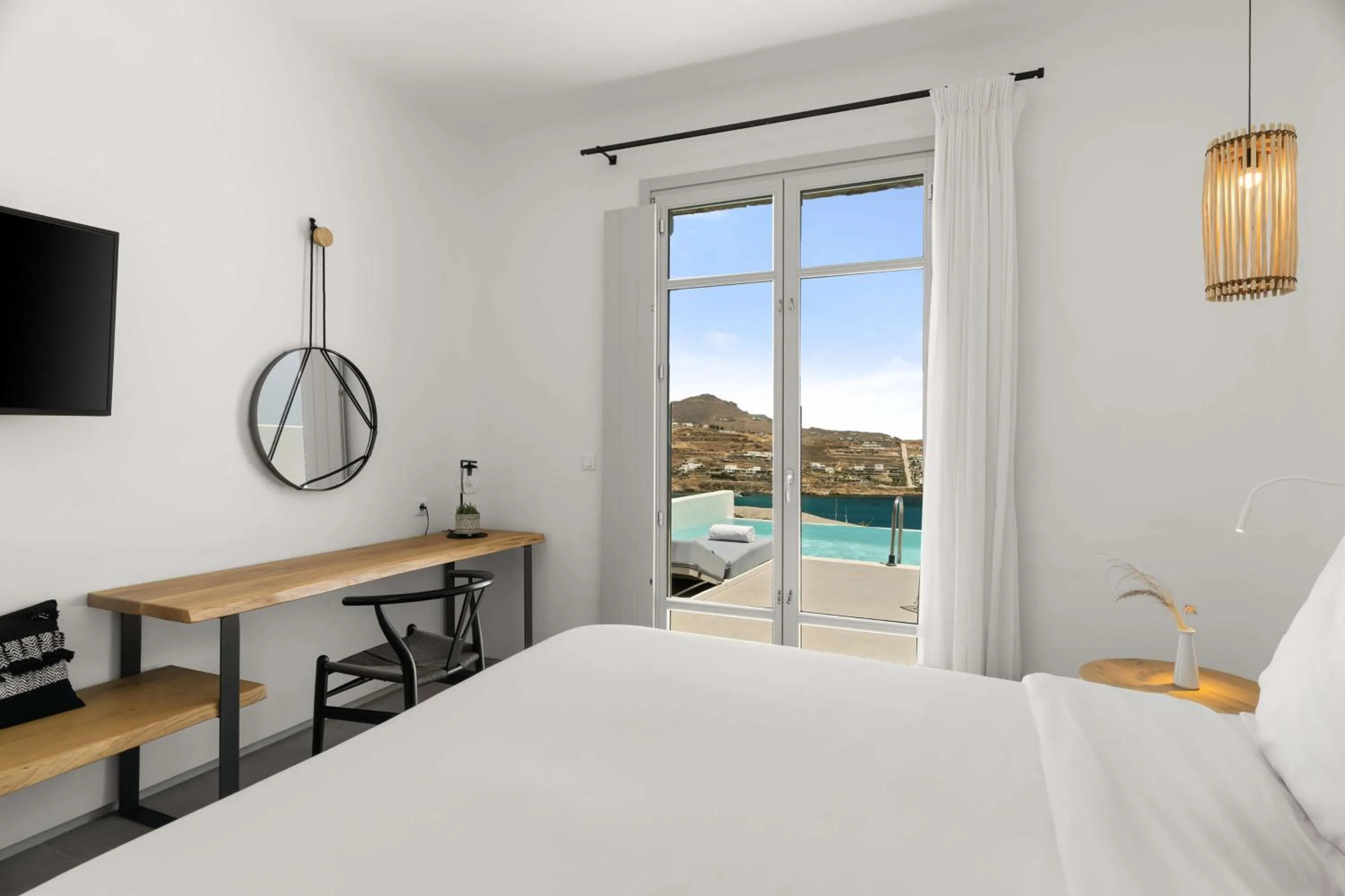Photo of the whole room, Bed in Radisson Blu Euphoria Resort, Mykonos