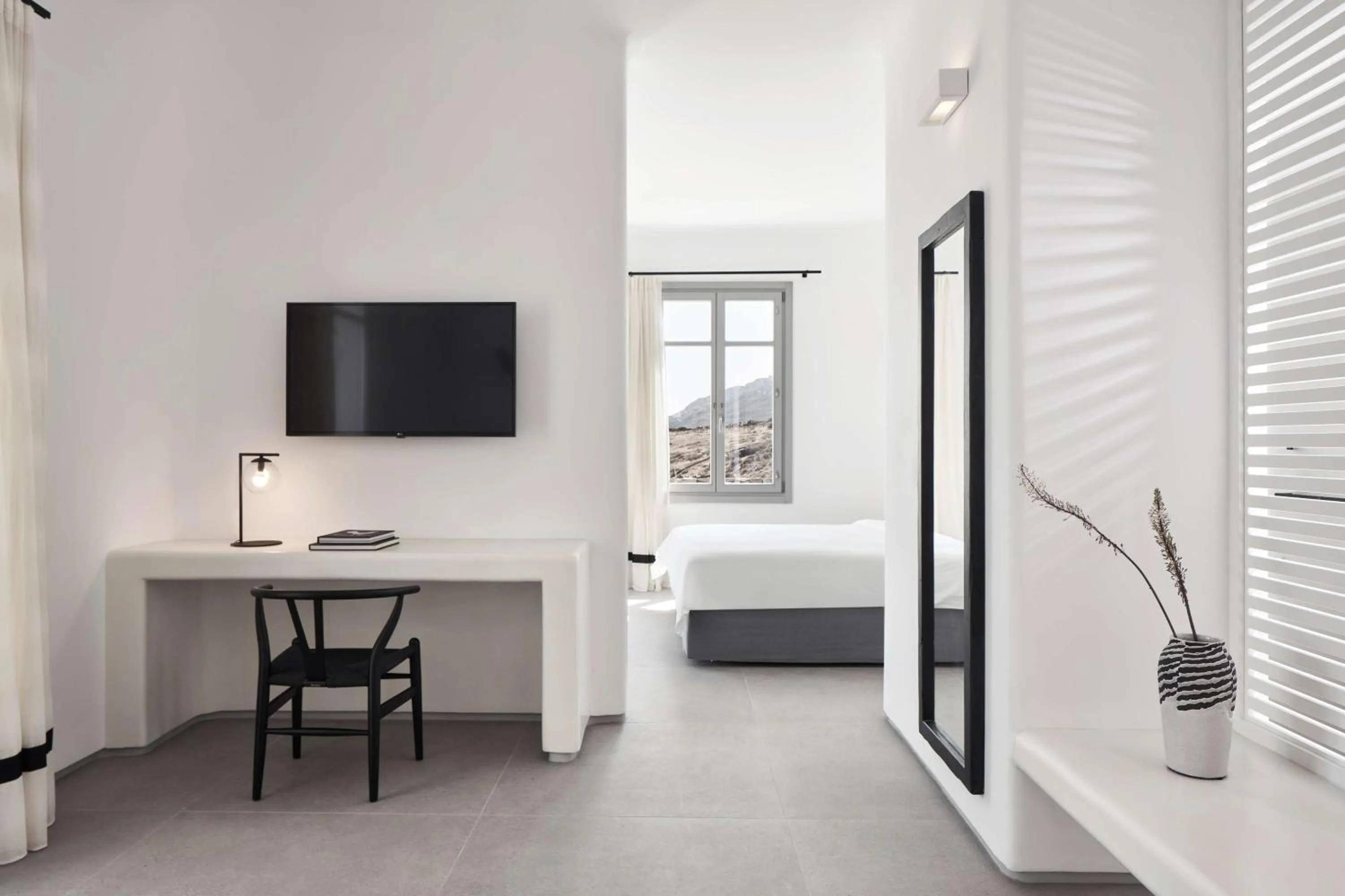 Living room, Bed in Radisson Blu Euphoria Resort, Mykonos