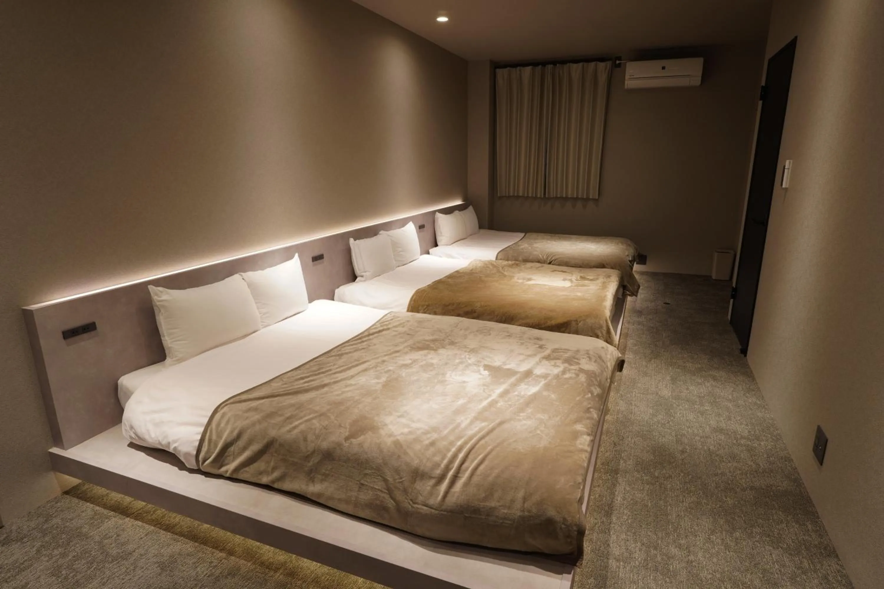 Bed in TABISAI HOTEL Luxe 博多