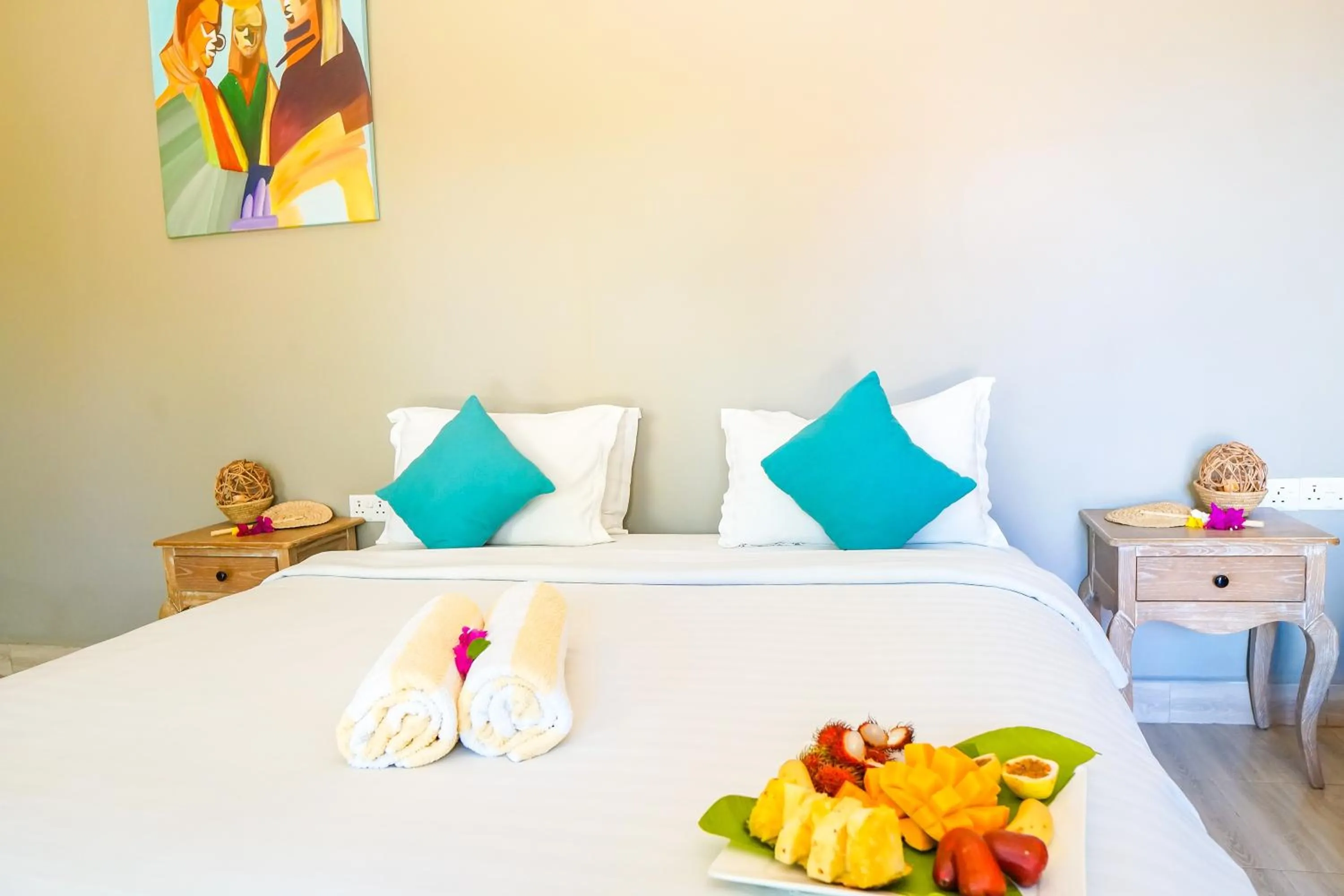 Bed in Aquamarina Hotel