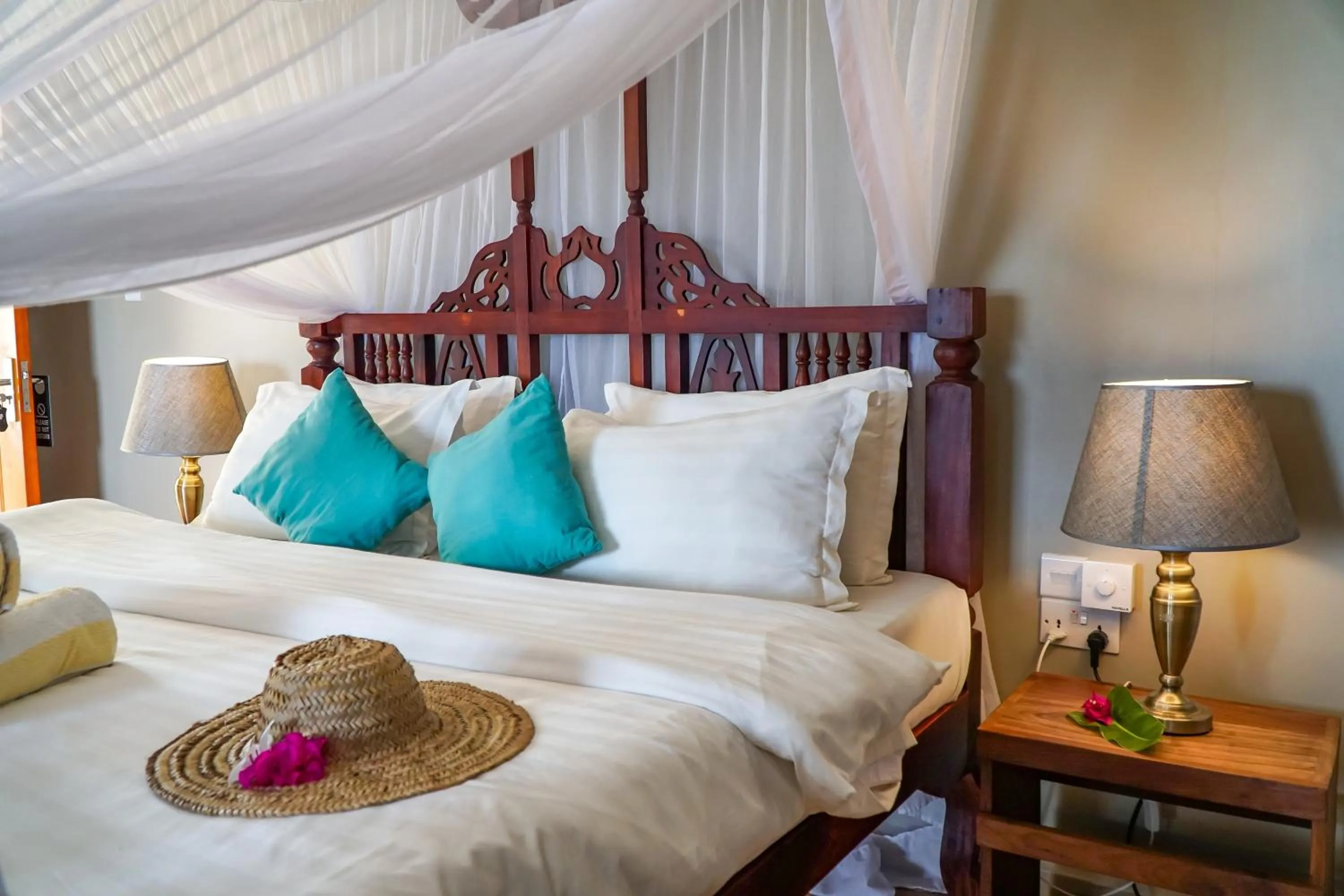 Bed in Aquamarina Hotel