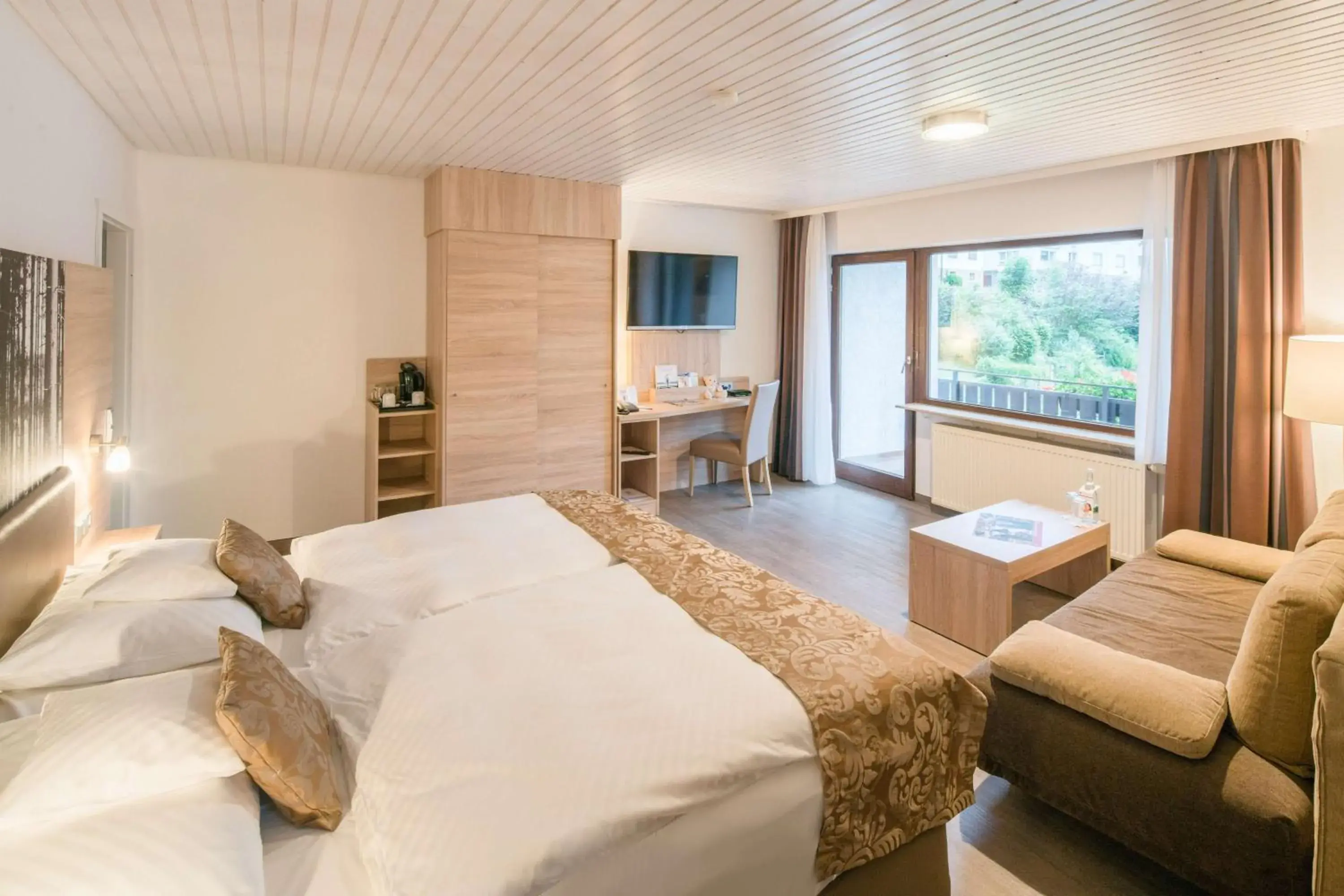 Bedroom, Bed in Best Western Plus Schwarzwald Residenz Bedroom, Bed in Best Western Plus Schwarzwald Residenz