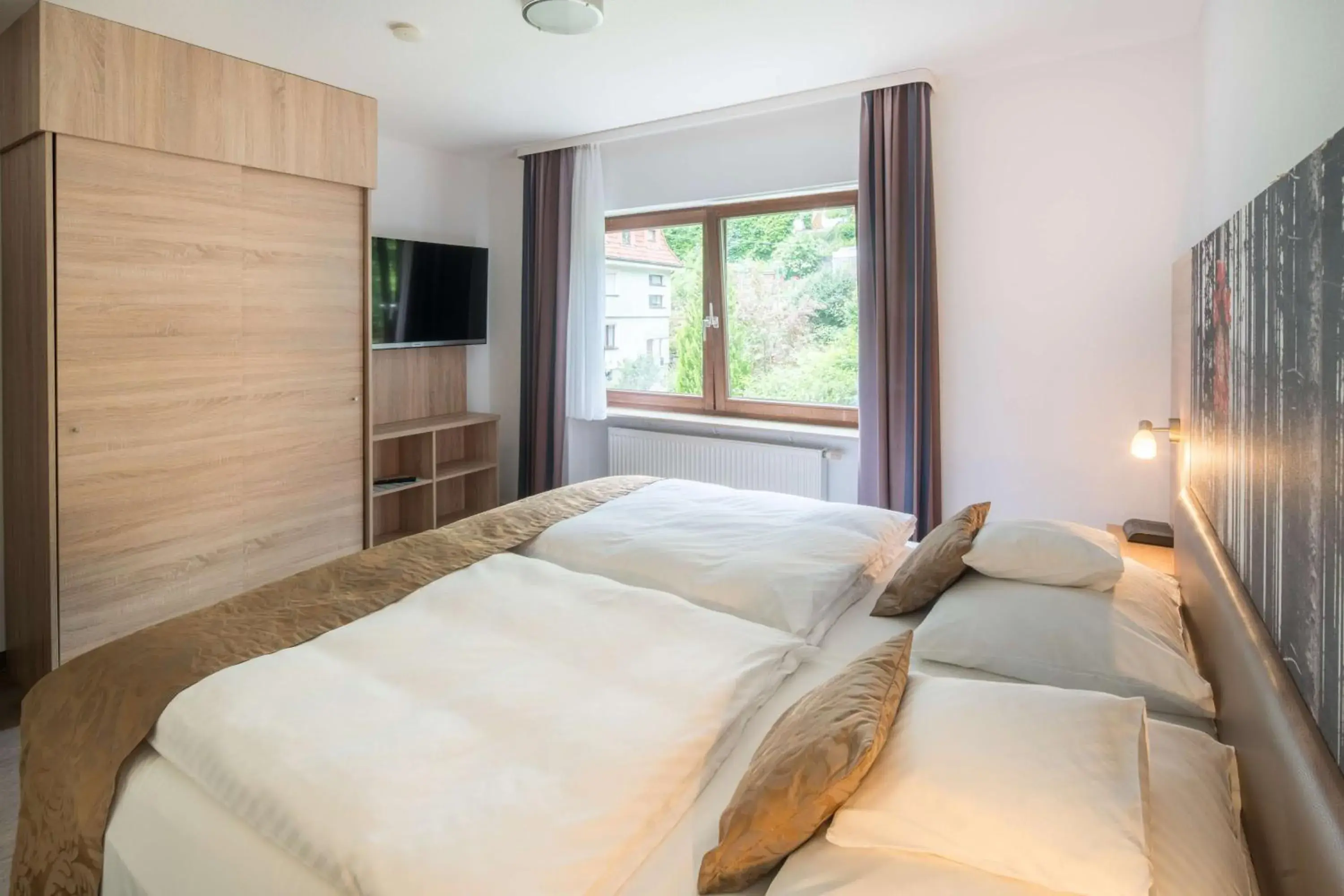 Bedroom, Bed in Best Western Plus Schwarzwald Residenz Bedroom, Bed in Best Western Plus Schwarzwald Residenz