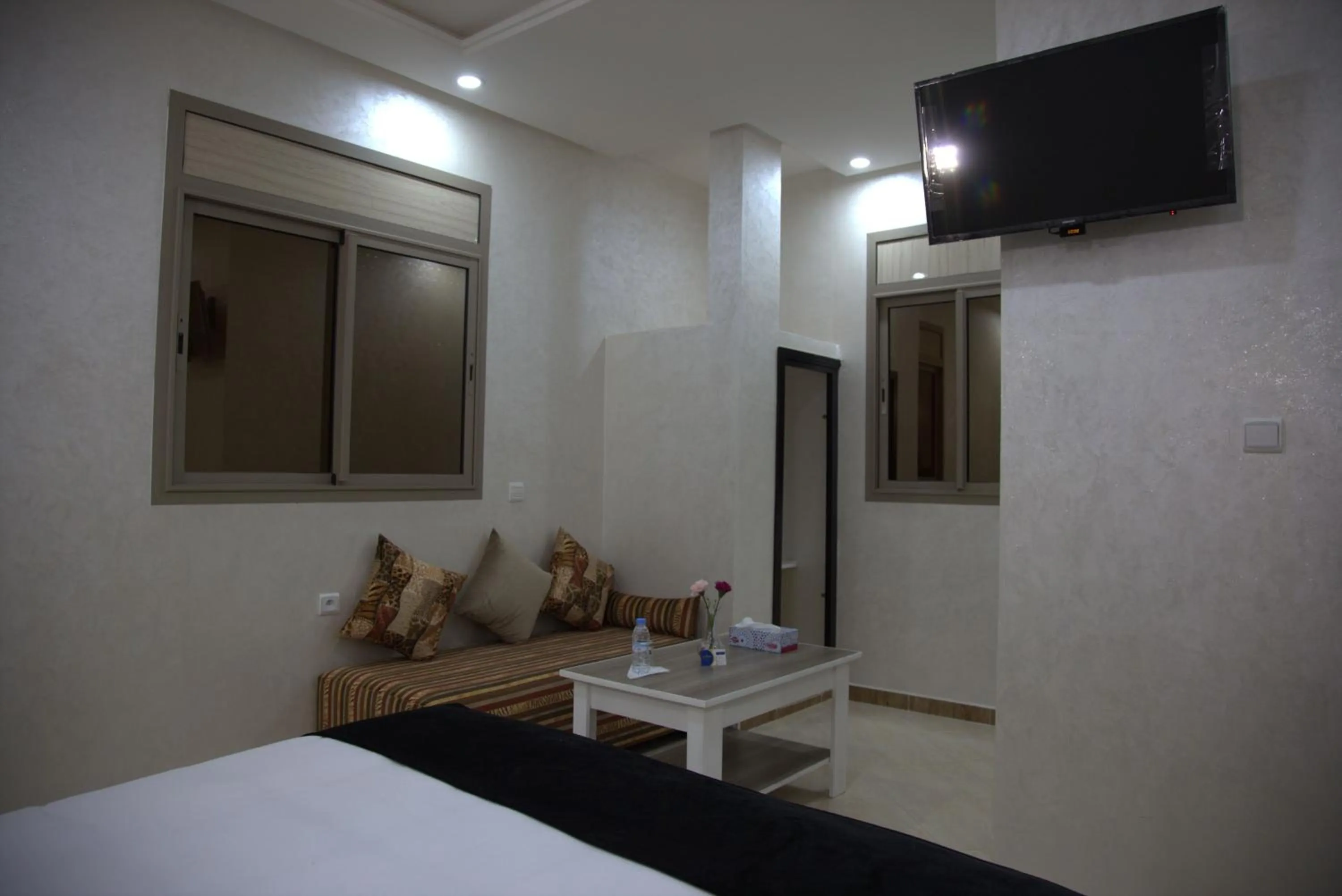 Communal lounge/ TV room, Bed in Dakhla Guest