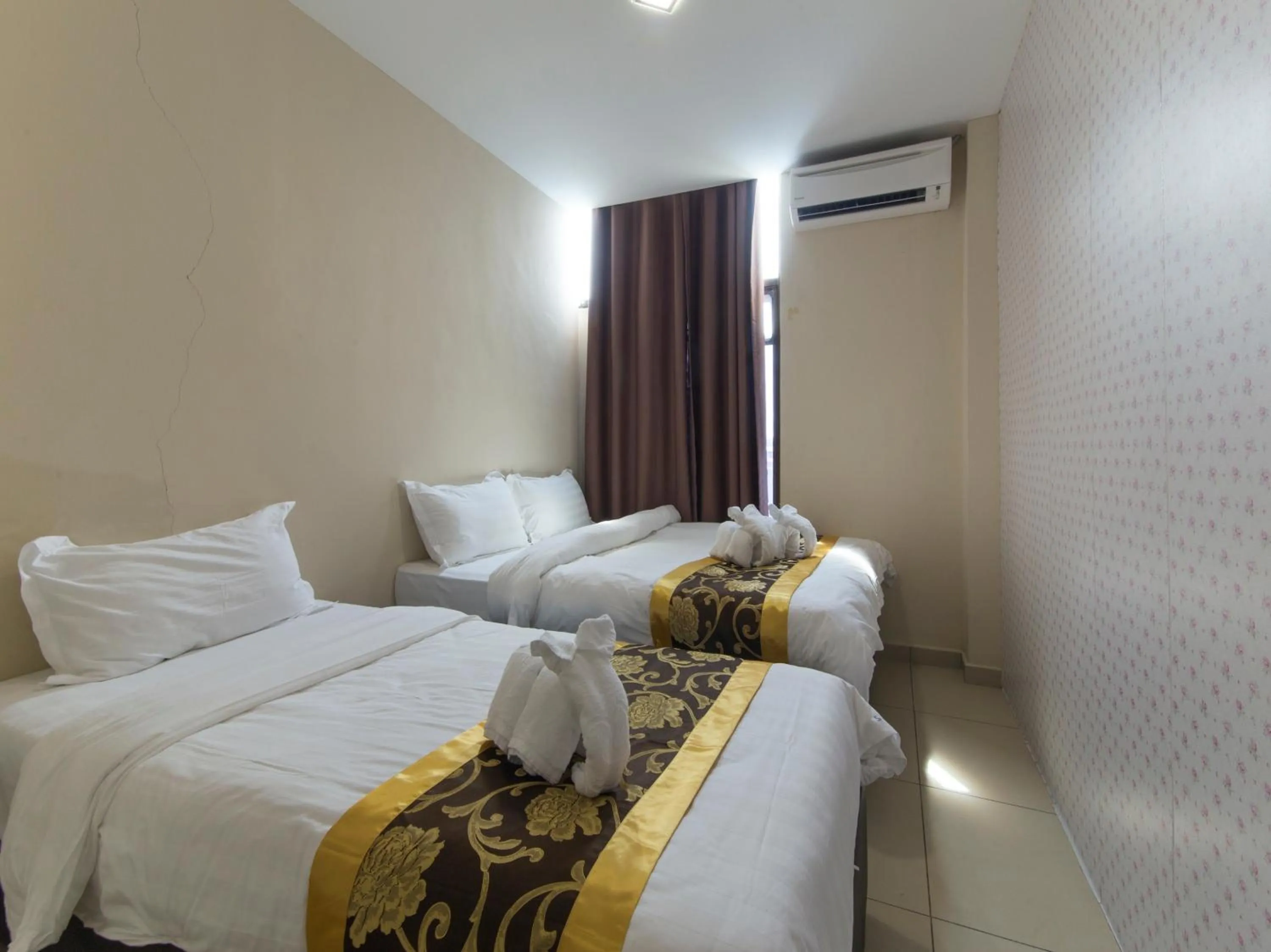 Bed in Top Garden Hotel