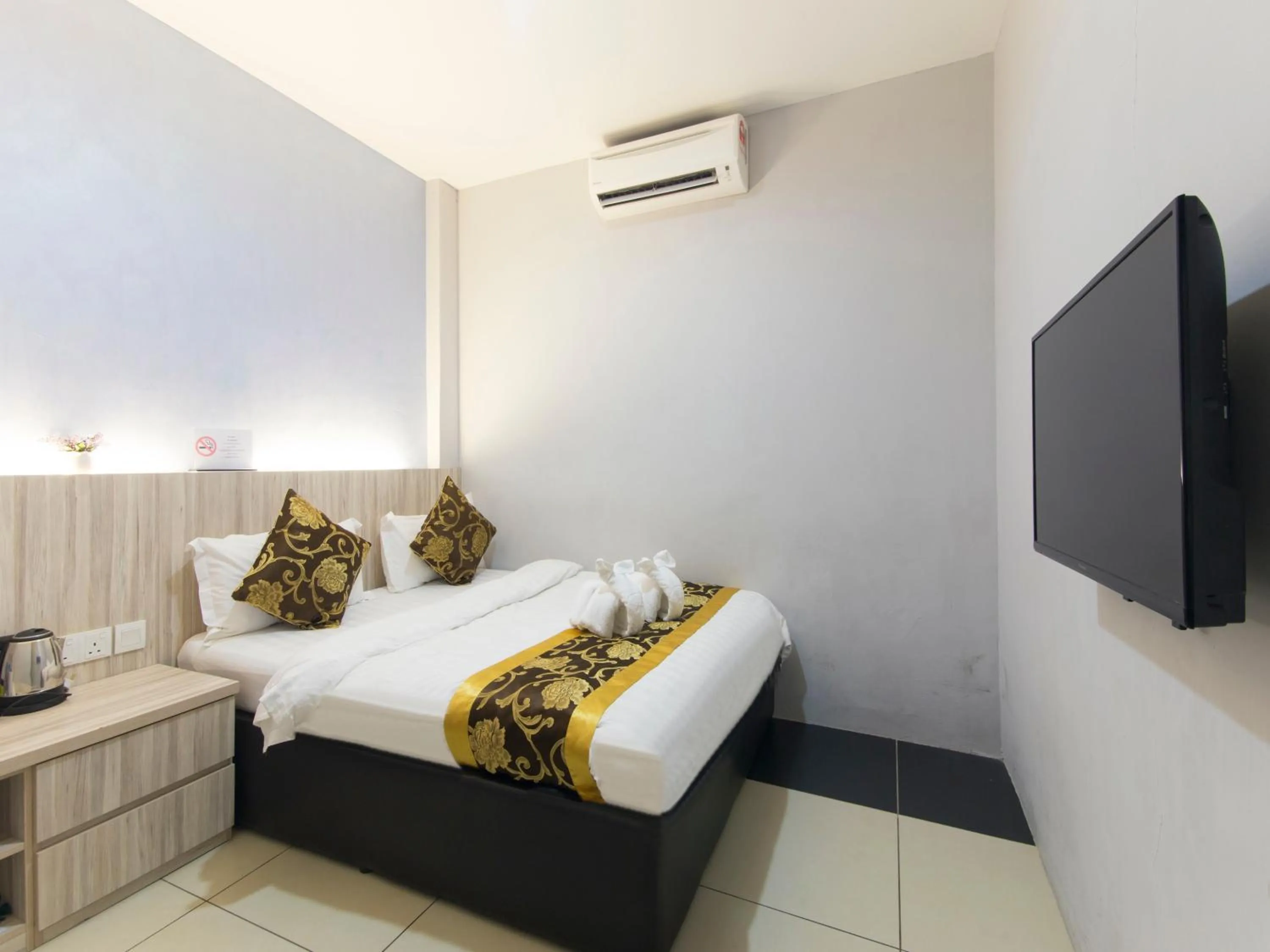 Bed in Top Garden Hotel