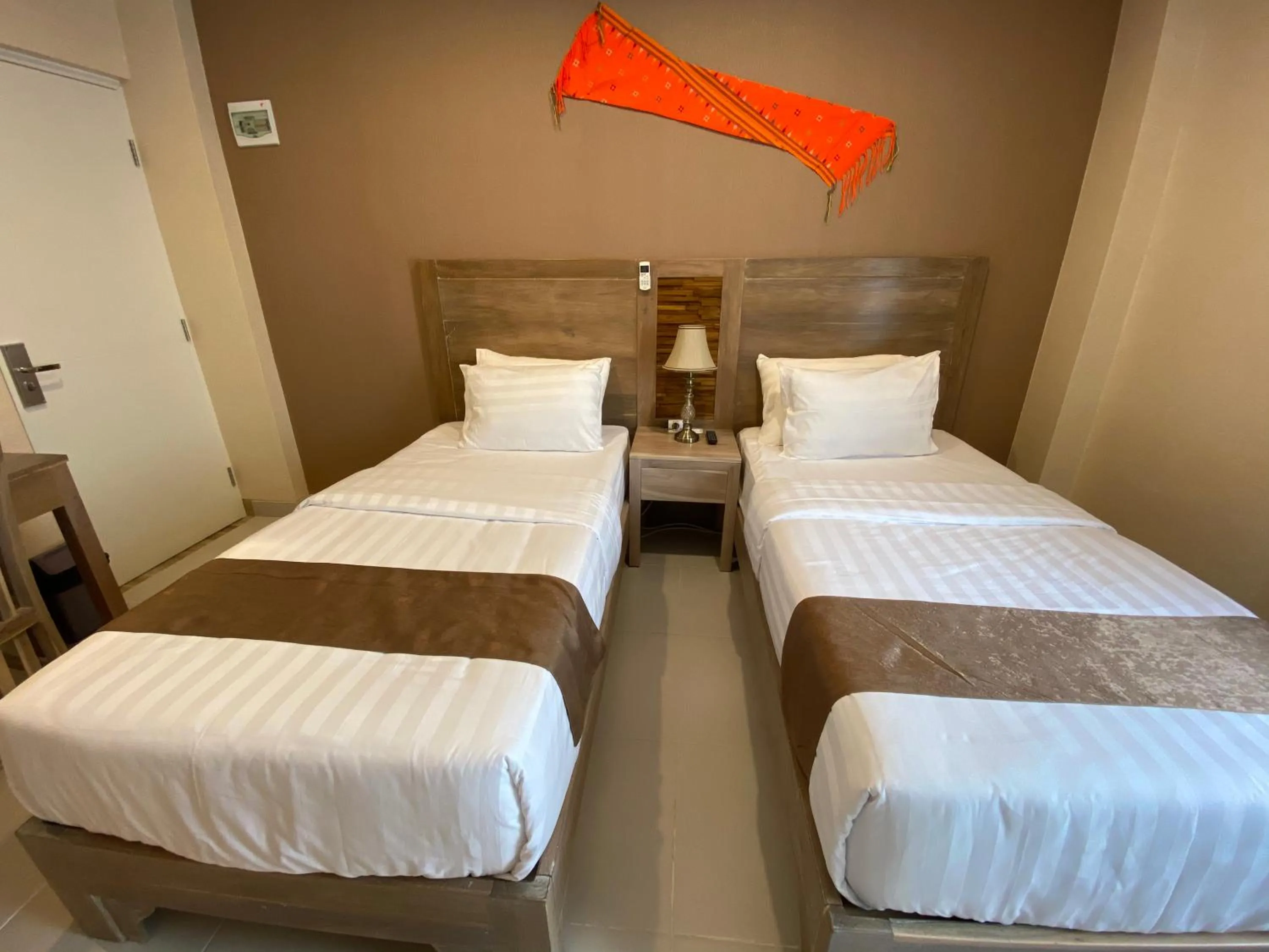 Bed in Flamingo Avia Labuan Bajo