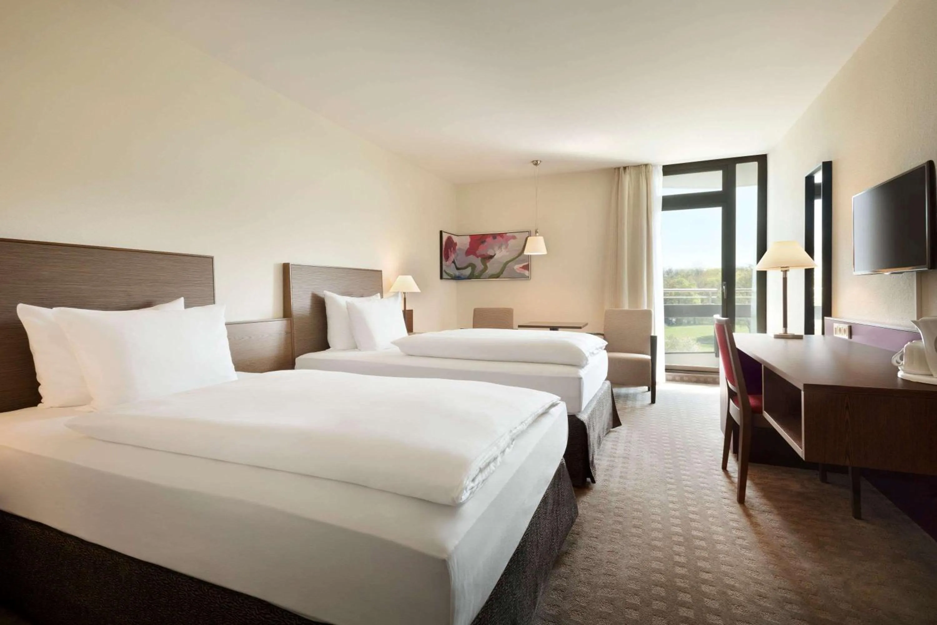 Photo of the whole room, Bed in Ramada Nürnberg Parkhotel