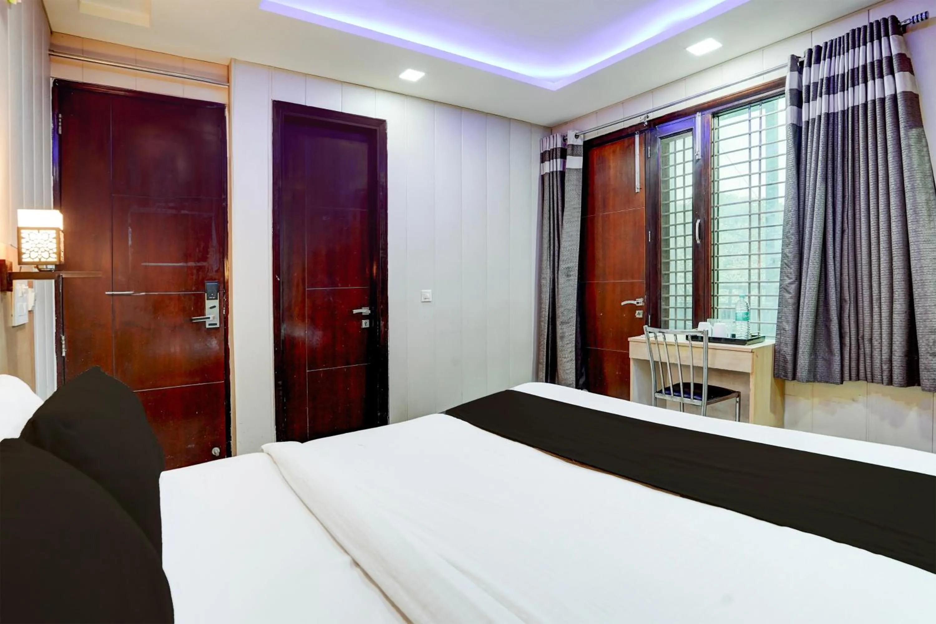 Bedroom, Bed in Super Hotel O Rohini Sector 24