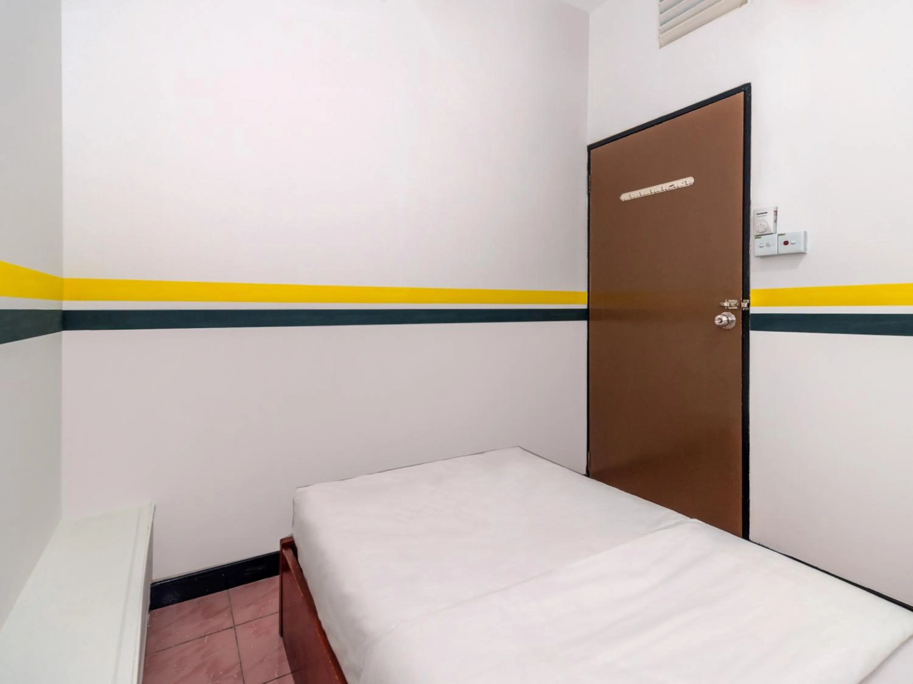 Bedroom in SPOT ON 89936 Sutera Inn