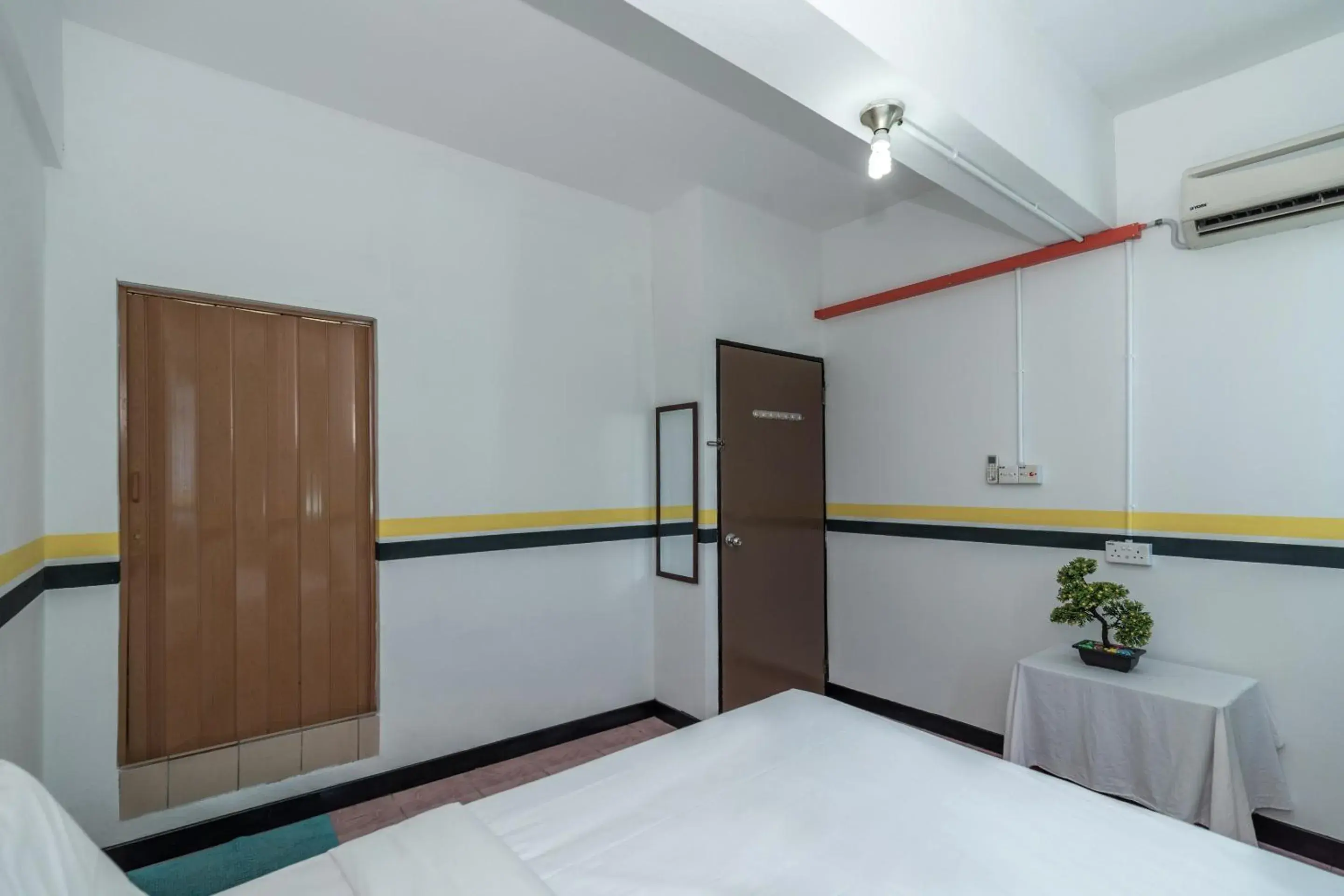 Bedroom in SPOT ON 89936 Sutera Inn