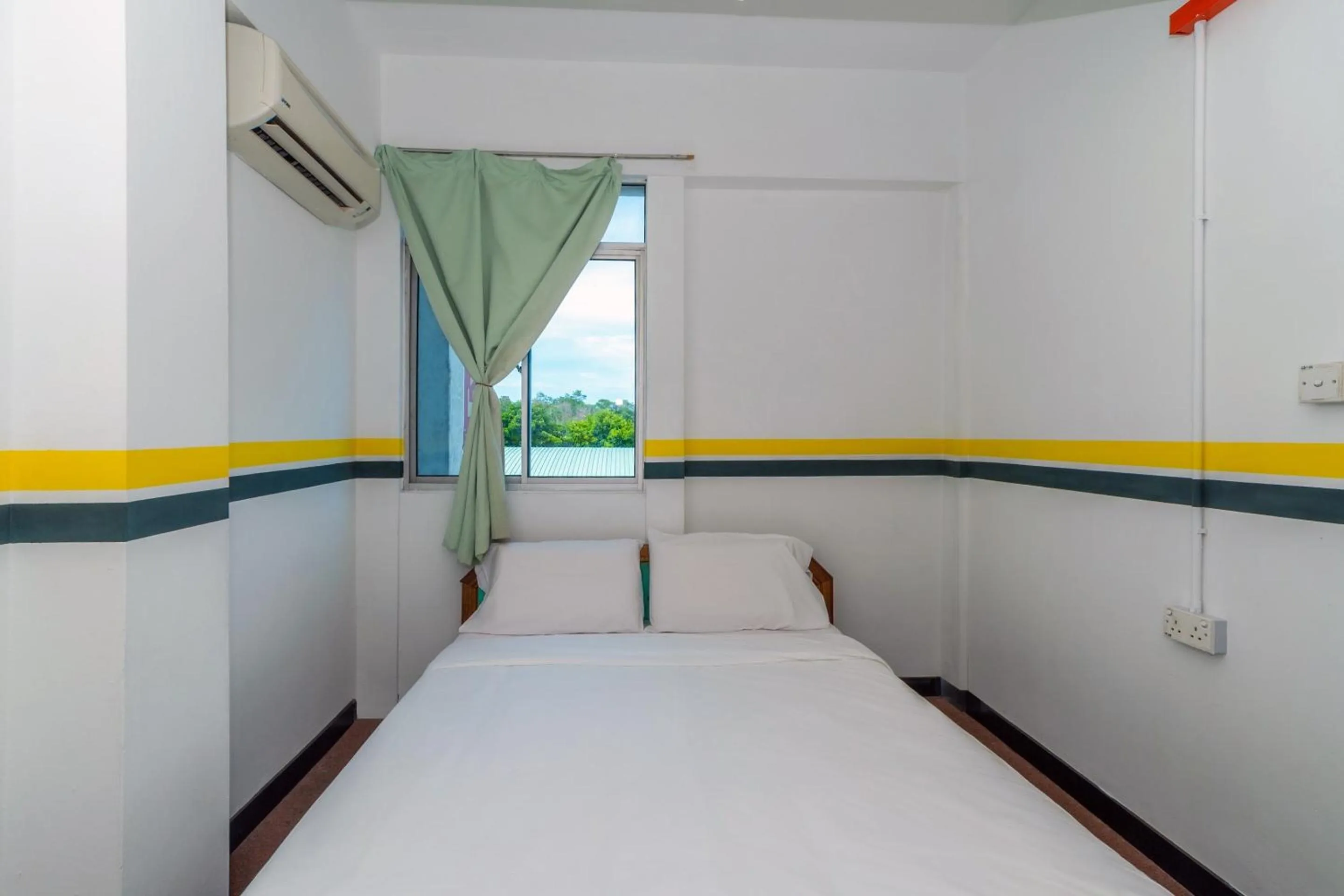 Bedroom in SPOT ON 89936 Sutera Inn