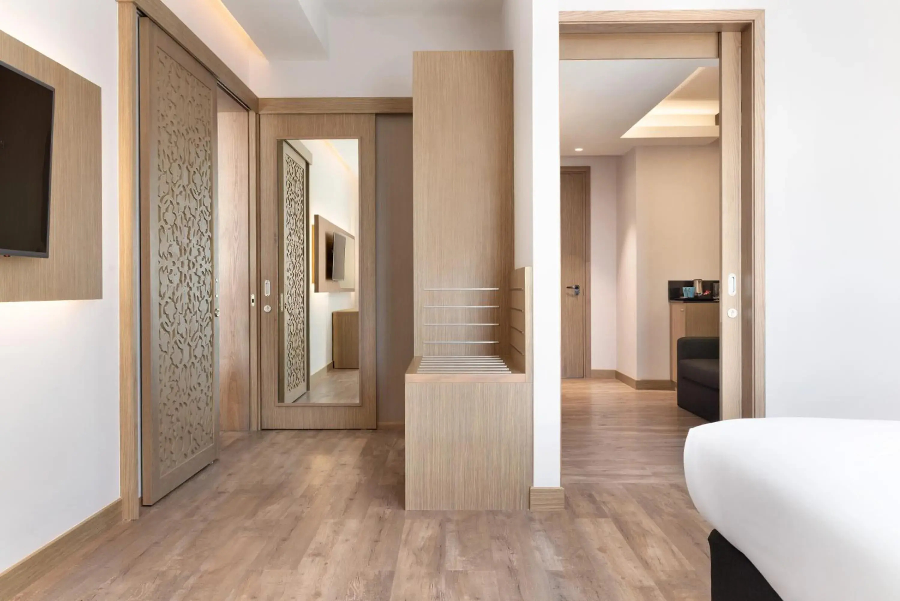 Living room, Bed in Ramada Encore by Wyndham Muscat Al-Ghubra Living room, Bed in Ramada Encore by Wyndham Muscat Al-Ghubra