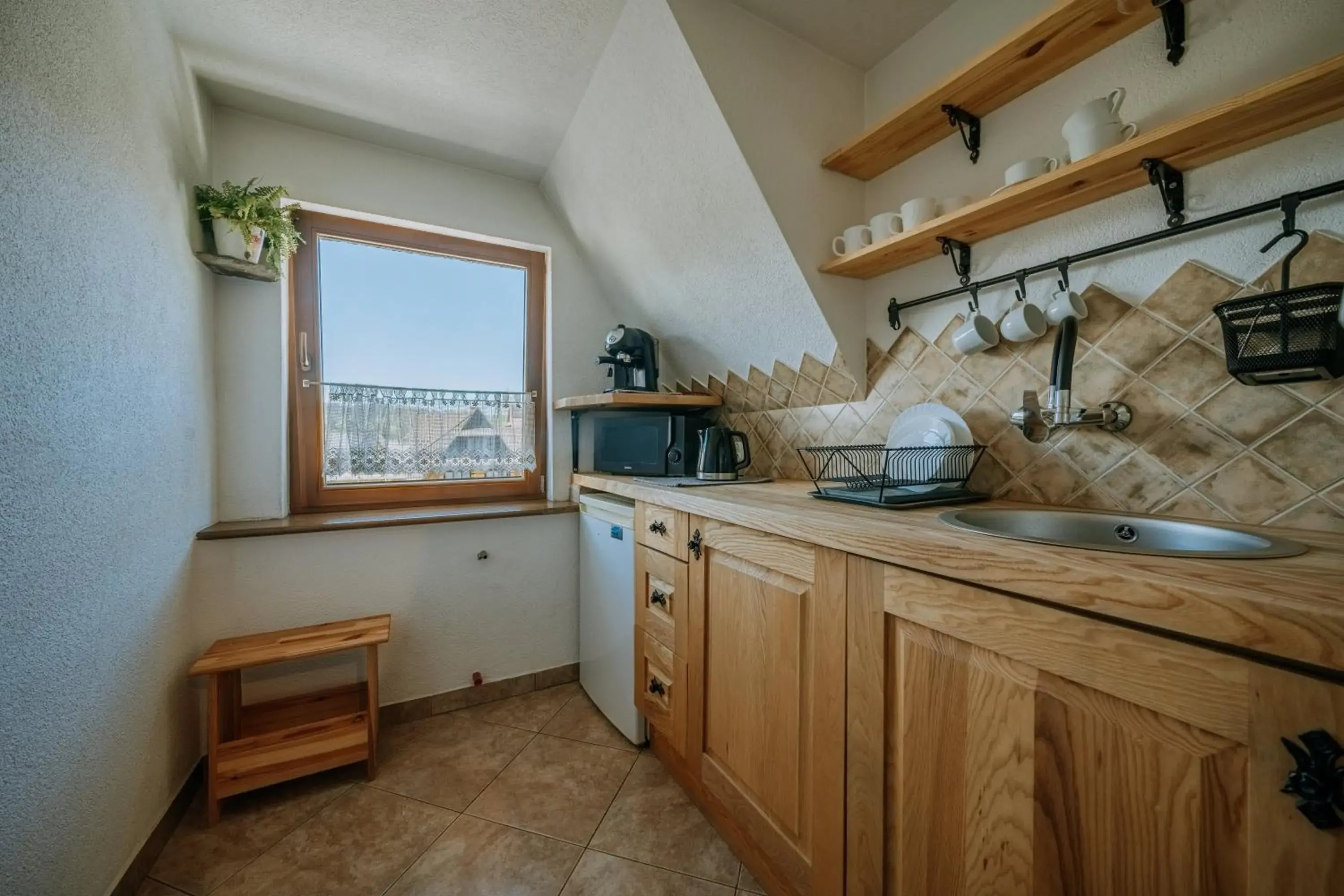 Kitchen or kitchenette in Gościna u Maryny Relaks i SPA w Ogrodzie Kitchen or kitchenette in Gościna u Maryny Relaks i SPA w Ogrodzie