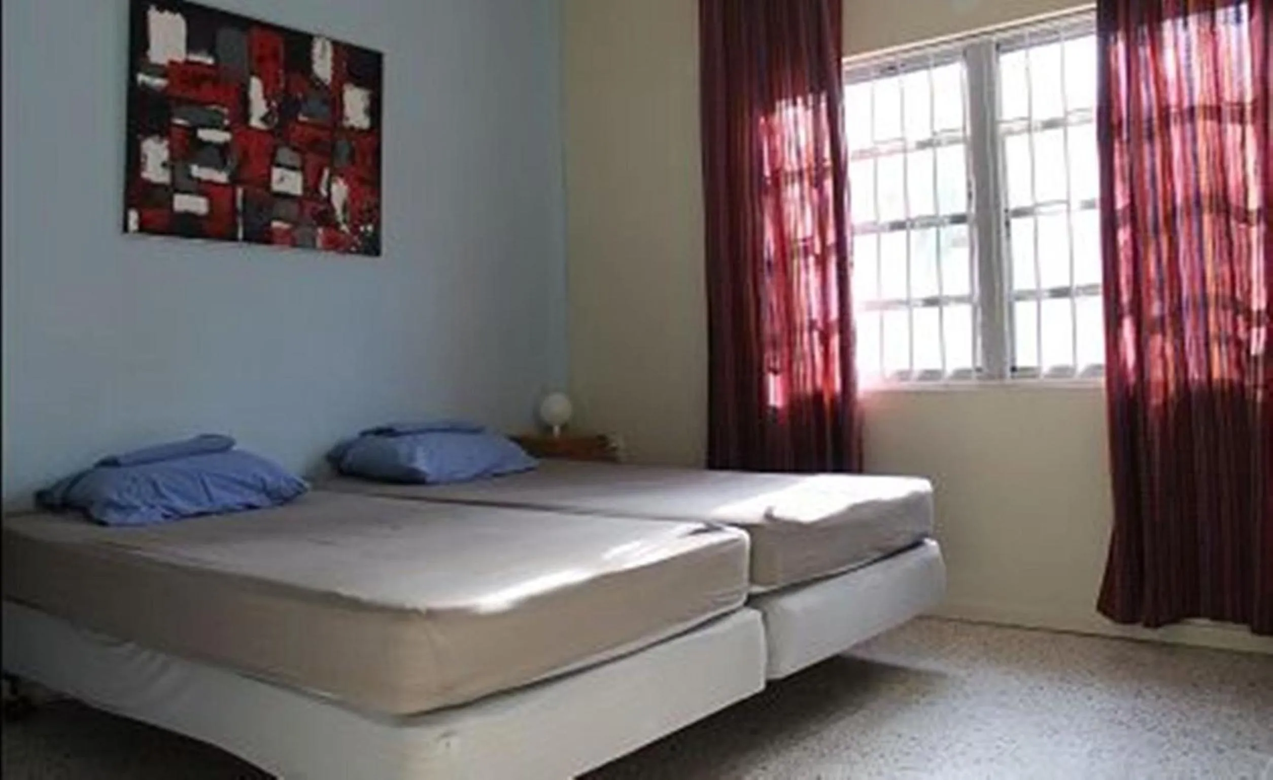 Bed in Caribbean Flower Apartments