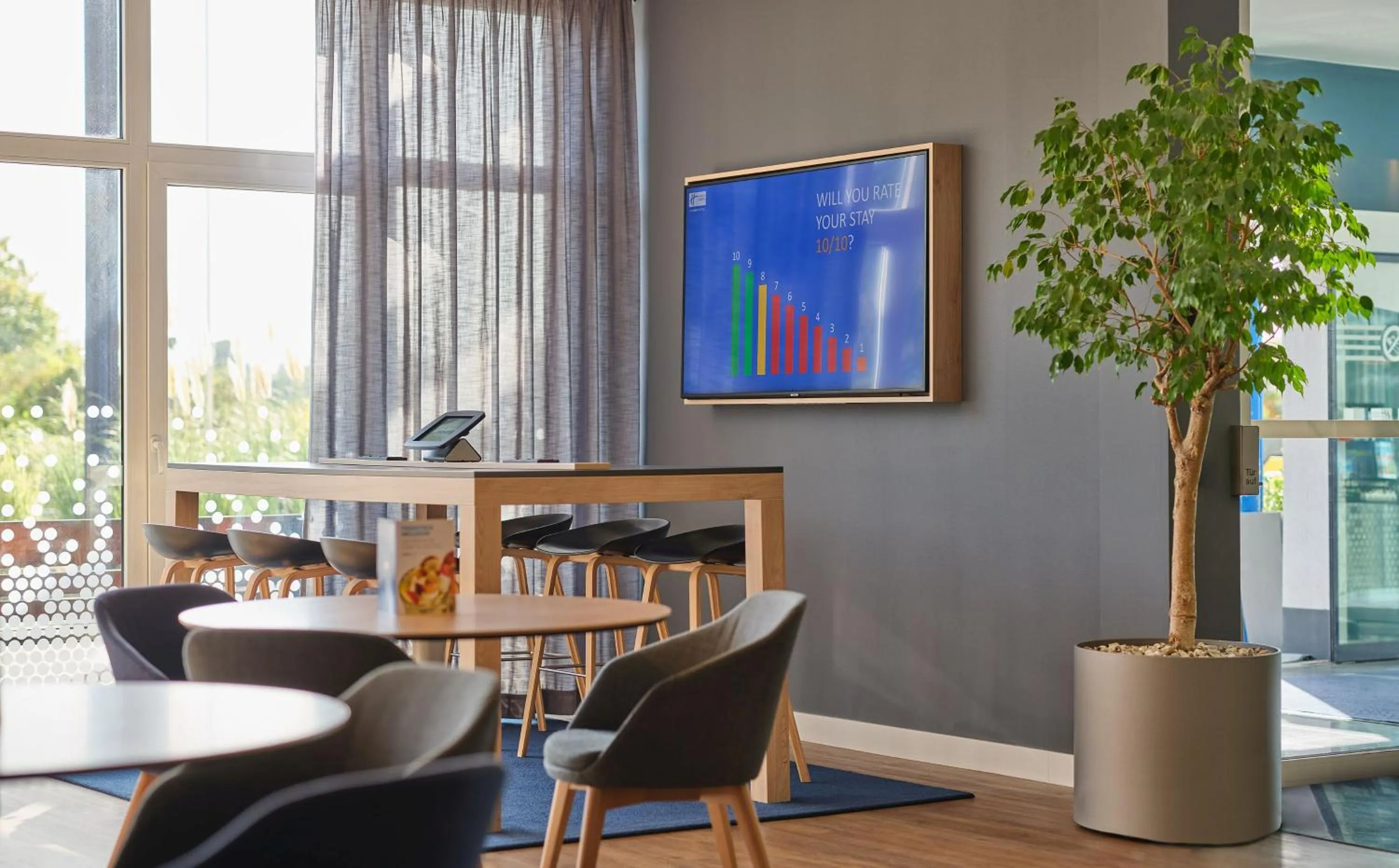 Seating area in Holiday Inn Express Frankfurt Airport by IHG