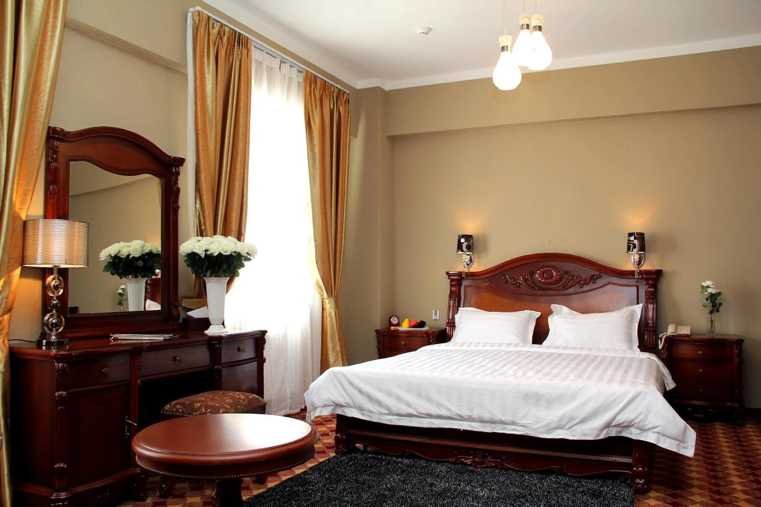 Photo of the whole room, Bed in UB City Hotel