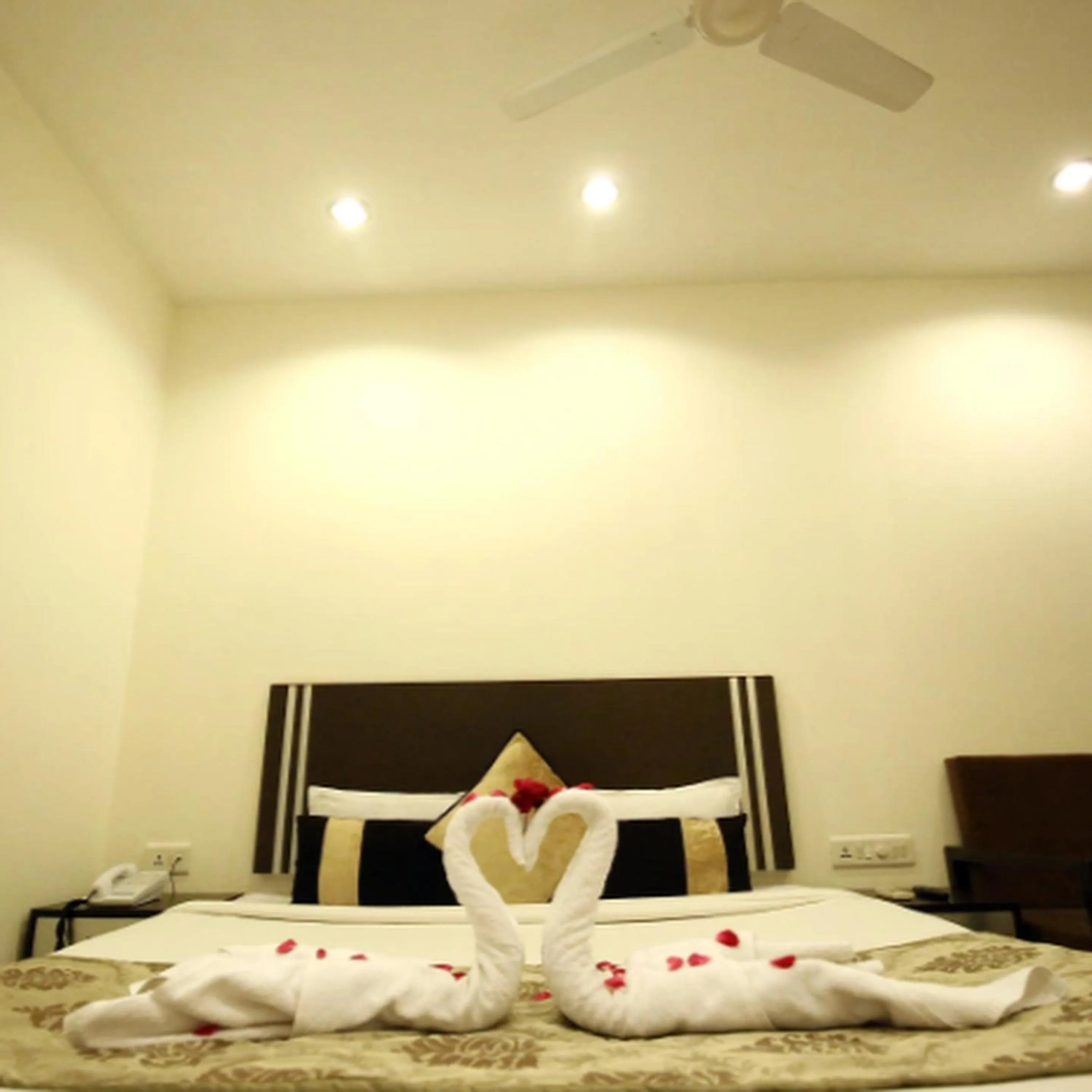 Bed in Regency Square Hotel