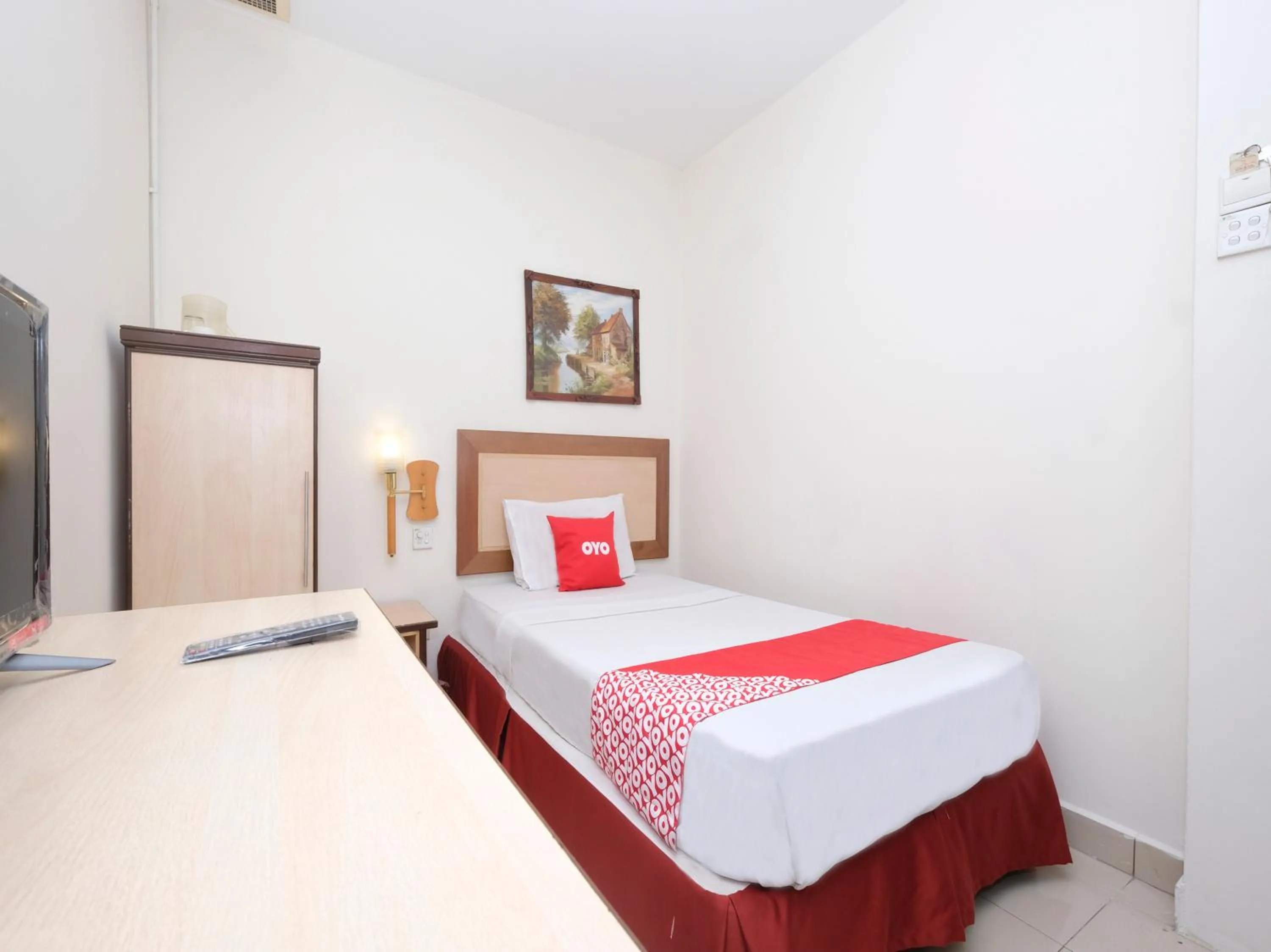 Bedroom in OYO 89968 Sri Sutra Hotel